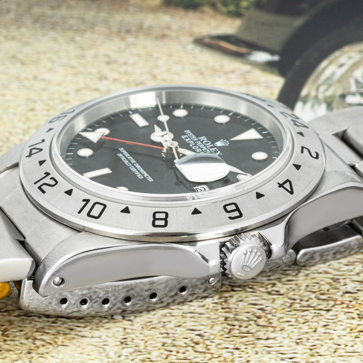 An Explorer II by Rolex in steel. Features a black dial with a date aperture, a red 24-hour hand and a stainless steel fixed bezel set with a 24-hour display. The watch is fitted with a sapphire glass, a self-winding automatic movement and a steel