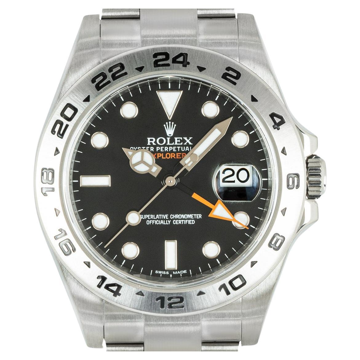 A men's Explorer II wristwatch in Oystersteel by Rolex. Features a black dial with applied hour markers, a date aperture, an orange 24-hour hand and a fixed stainless steel bezel featuring an engraved 24-hour display.

Fitted with a sapphire glass