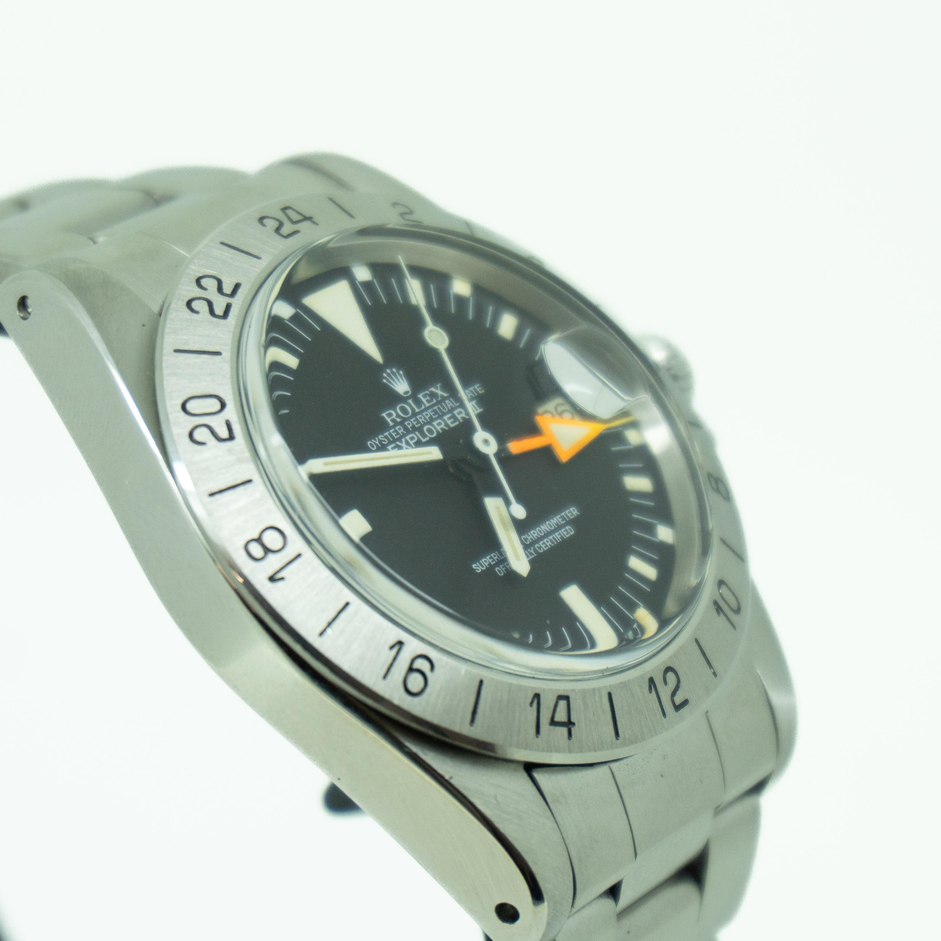 This Rolex Explorer II 1655 has a black baton dial and a bracelet strap.
Tritium (