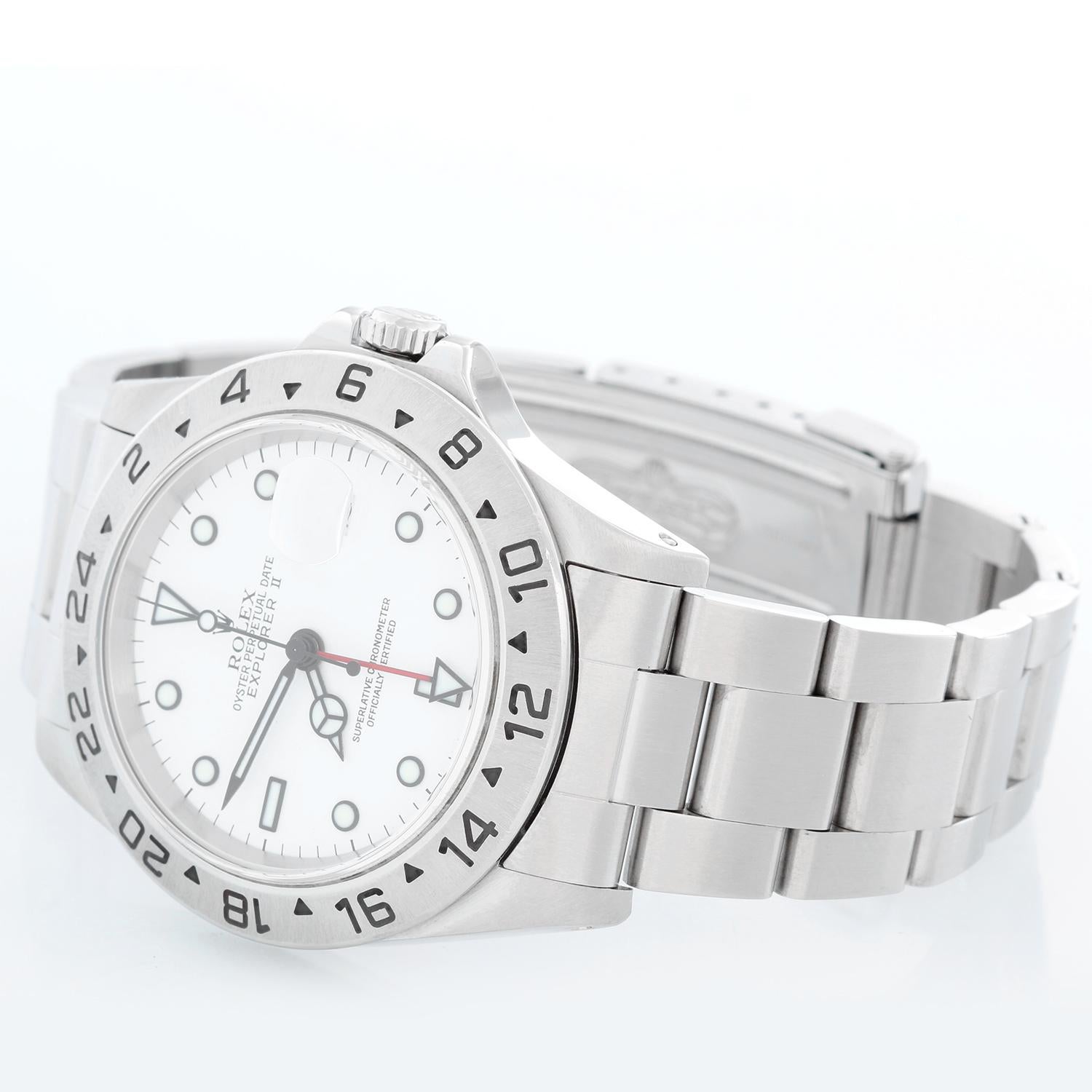 Rolex Explorer II Men's Stainless Steel Watch 16570 - Automatic winding, 31 jewels, Quickset, sapphire crystal, dual time. Stainless steel case (40mm diameter). White dial with luminous markers. Stainless steel Oyster bracelet. Pre-owned with box