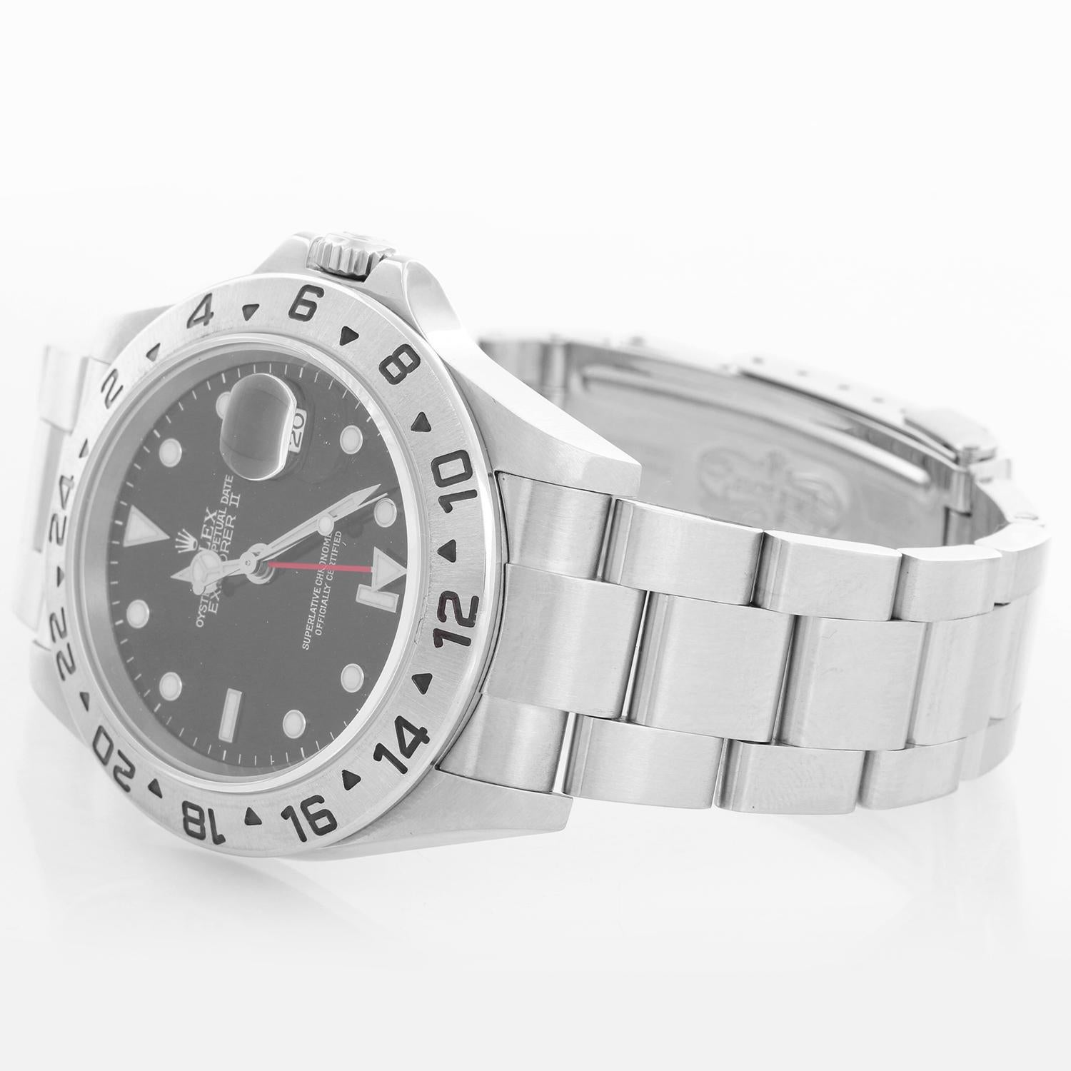 Rolex Explorer II Men's Stainless Steel Watch 16570 - Automatic winding, 31 jewels, Quickset, sapphire crystal, dual time. Stainless steel case (40mm diameter). Black dial with luminous markers. Stainless steel Oyster bracelet. Pre-owned with box
