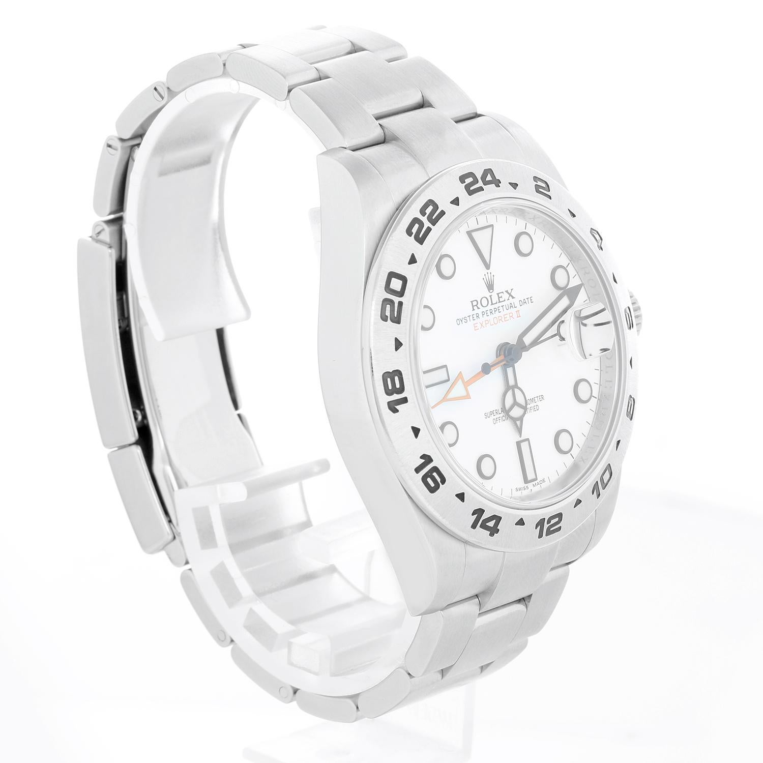 Rolex Explorer II Men's Stainless Steel Watch 216570 - Automatic winding, 31 jewels, Quickset, sapphire crystal, dual time. Stainless steel case (42mm diameter). White dial with white markers. Stainless steel Oyster bracelet with flip-lock clasp.
