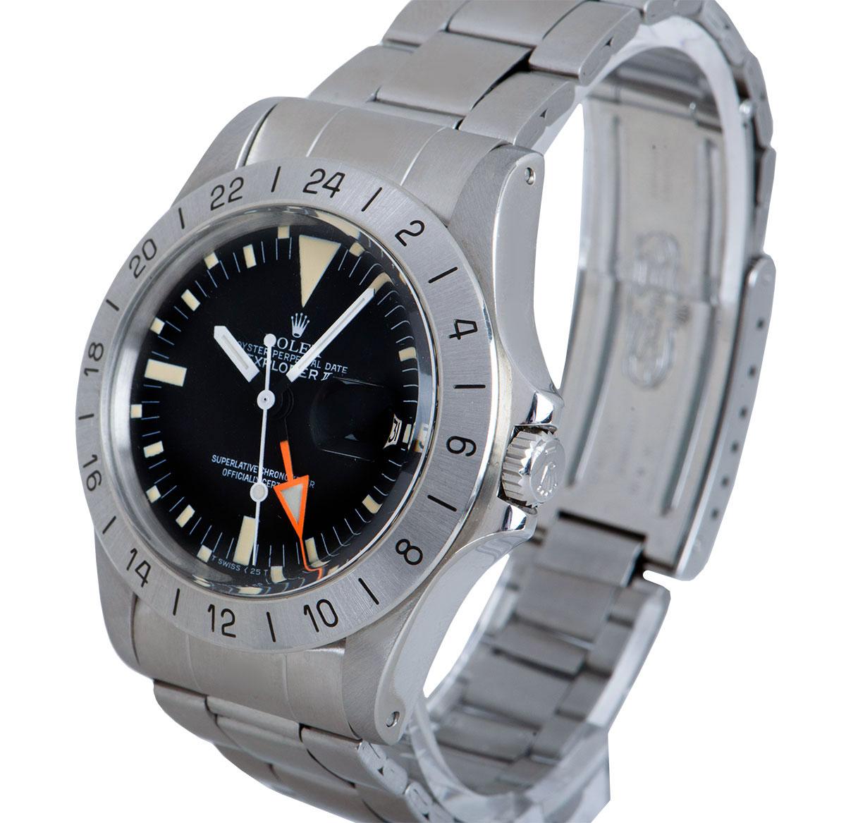 A 40 mm Stainless Steel Explorer II Steve McQueen Vintage Gents Wristwatch, original matte black dial with hour markers, date at 3 0'clock, orange GMT hand, a fixed stainless steel 24 hour bezel, a stainless steel folded oyster bracelet with a