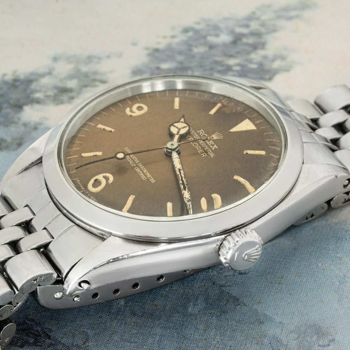 A 36mm, vintage Rolex Explorer in stainless steel. Featuring a distinctive rare tropical dial with arabic numbers and a smooth, fixed stainless steel bezel. Fitted with a plexiglass, self-winding automatic movement and a Jubilee bracelet equipped