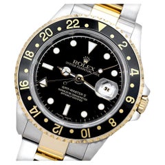 Used Rolex GMT-Master 16713 Stainless Steel and Yellow Gold Watch with Black Dial 