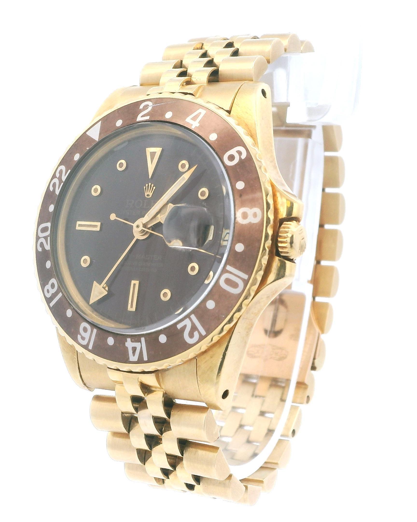 Rolex GMT-Master 1675 Mens Watch. 40mm 18K yellow gold case. Unidirectional rotating 18K yellow gold bezel with brown bezel insert; it has scratches and sing of wear. Gloss root beer dial with gold hands and nipple index hour markers; due to its