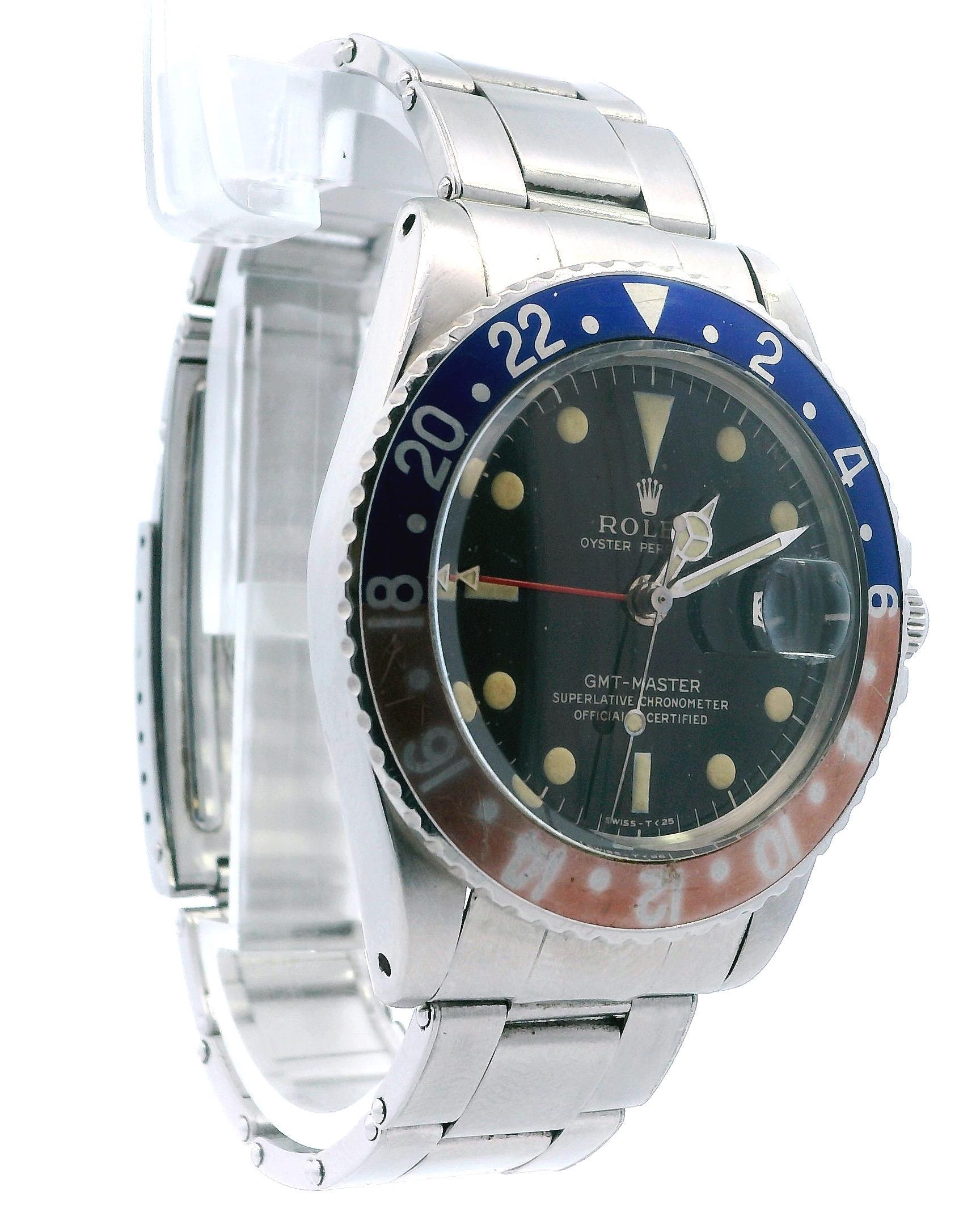 Rolex GMT Master 1675 steel case, year of production 1966, bidirectional steel bezel with Aluminium insert Pepsi colors, plastic glass with cyclops lens, rare glossy black dial with gilt graphics and closed minute track, indexes and hands to tritium