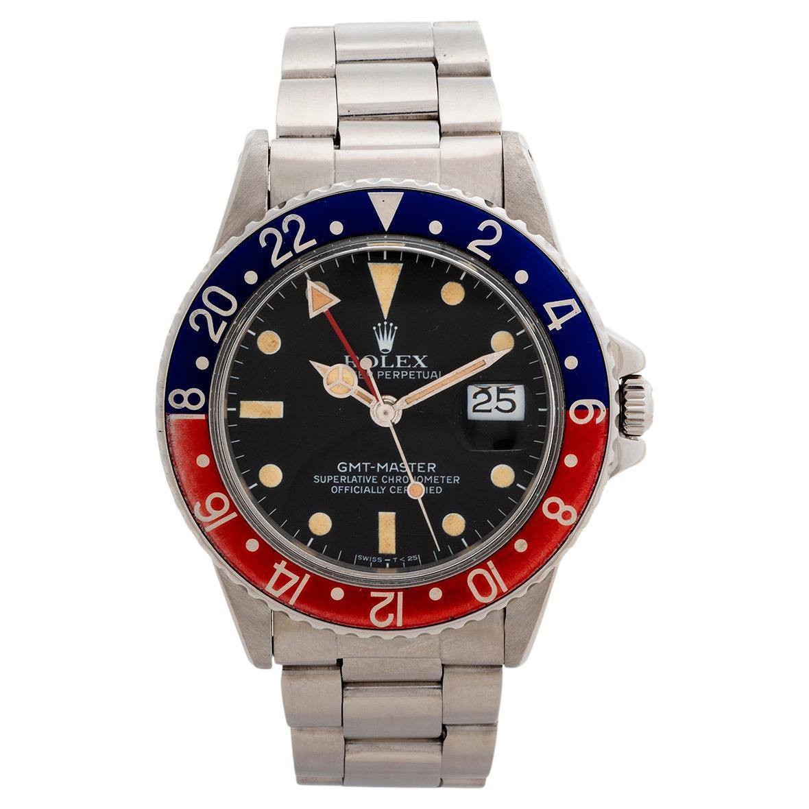 Our vintage and rare Rolex GMT Master is a transitional reference 16750, is a particularly attractive example; with original and coeval patination to the matte tritium dial and hands, gently faded red/ blue pepsi bezel insert and date matched serial