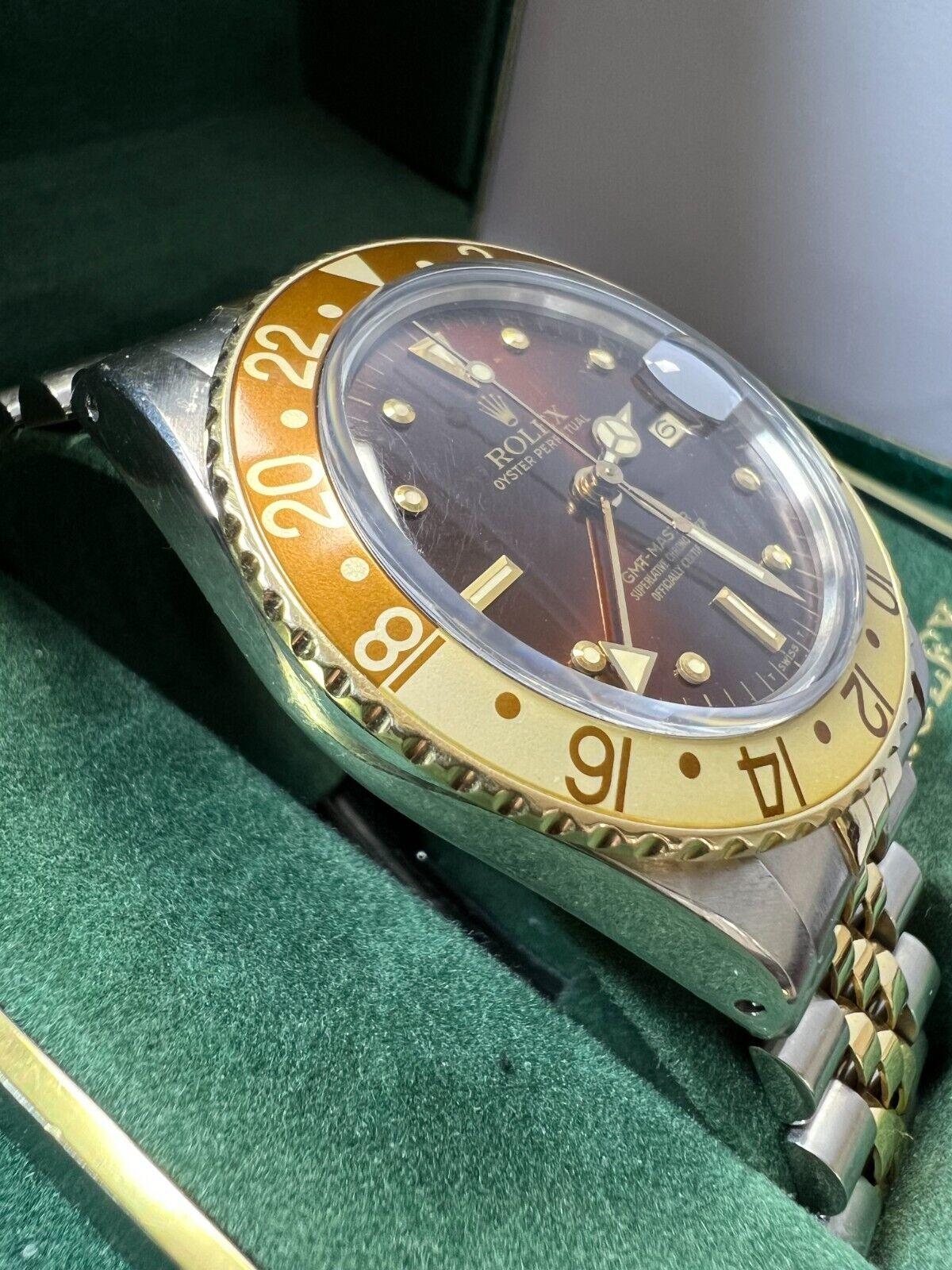 Style Number: 16753

 

Serial: 7622***


Year: 1983

 

Model: GMT Master

 

Case Material: Stainless Steel 

 

Band: 18K Yellow Gold & Stainless Steel 

 

Bezel:  Root Beer 

 

Dial: Brown 

 

Face: Acrylic 

 

Case Size: 40mm 

 

Includes: