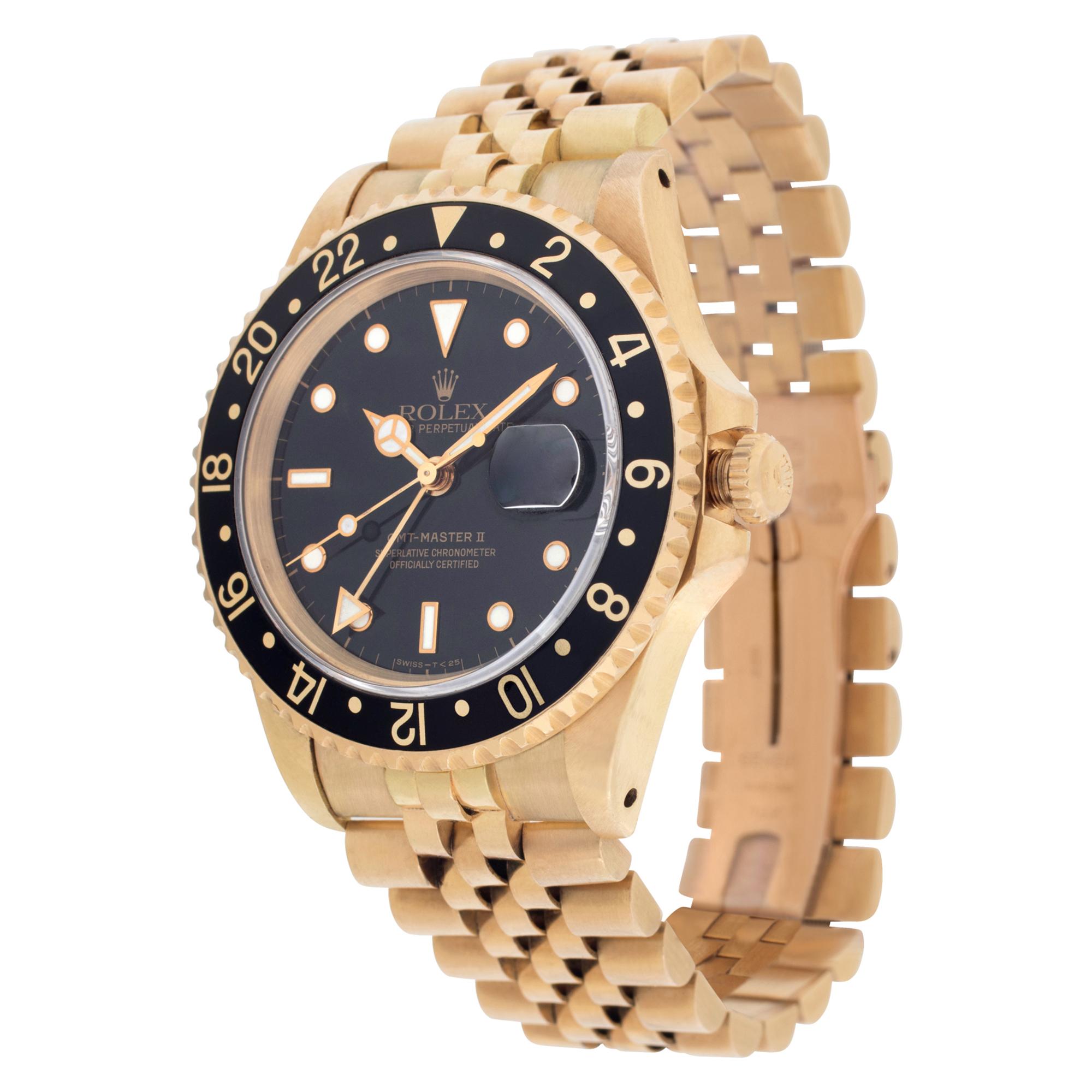 Rolex GMT Master in 18k with black dial & bezel on a Jubilee band. Auto with sweep seconds, date and dual time. 40 mm case size. Circa 1991. With box and papers. **Bank wire only at this price** Ref 16718. Fine Pre-owned Rolex Watch.

Certified
