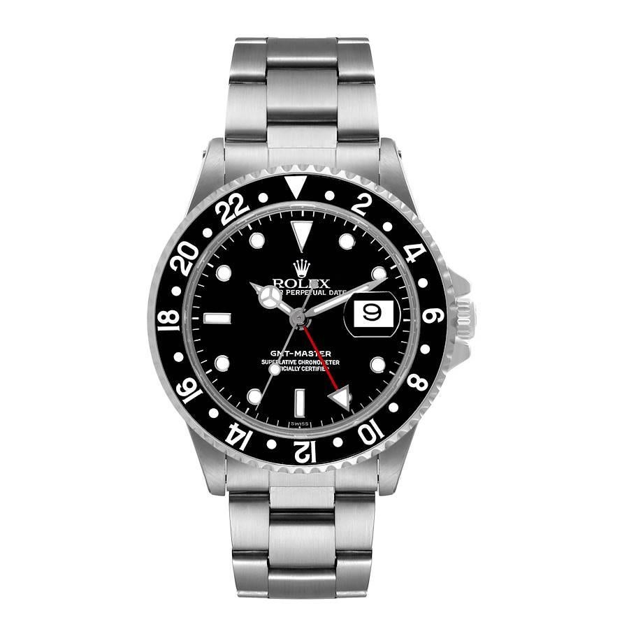 Rolex GMT Master Black Bezel Automatic Steel Mens Watch 16700 Box Papers. Officially certified chronometer self-winding movement. Stainless steel case 40.0 mm in diameter. Rolex logo on a crown. Bidirectional rotating bezel with a special 24-hour