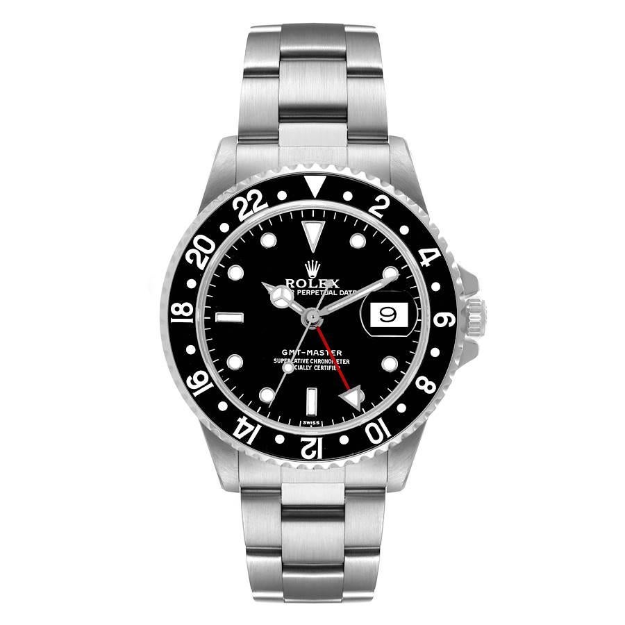 Rolex GMT Master Black Bezel Automatic Steel Mens Watch 16700. Officially certified chronometer self-winding movement. Stainless steel case 40.0 mm in diameter. Rolex logo on a crown. Bidirectional rotating bezel with a special 24-hour black bezel