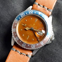 Rolex GMT-Master Glossy Tropical Gilt O.C.C. Dial 1675 Steel Watch, 1960