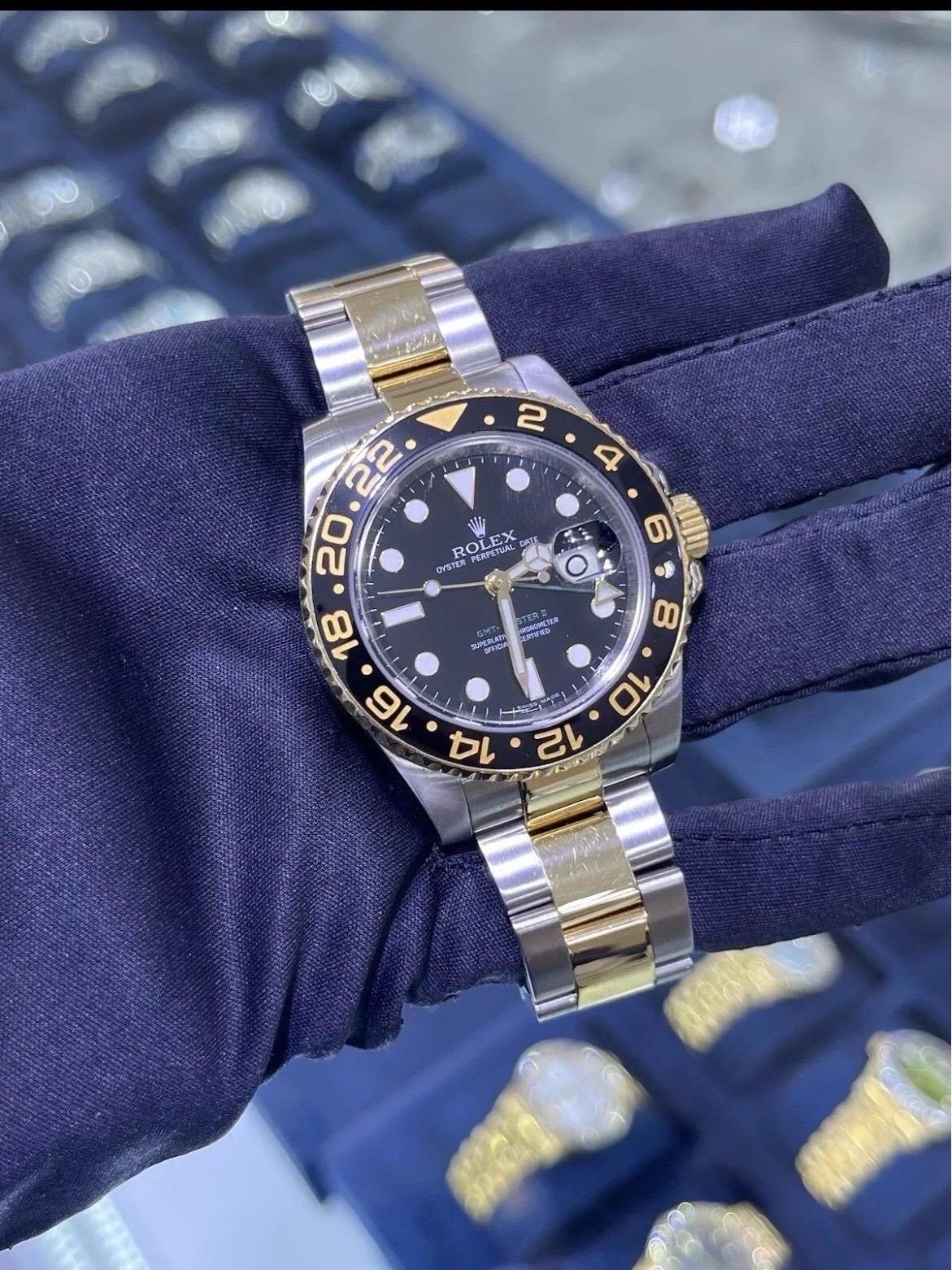 The Rolex GMT-Master II 116713 Black Ceramic Two-Tone is a remarkable timepiece that seamlessly blends luxury, precision, and durability. Featuring a striking 40mm case, this watch combines the robustness of stainless steel with the elegance of 18K