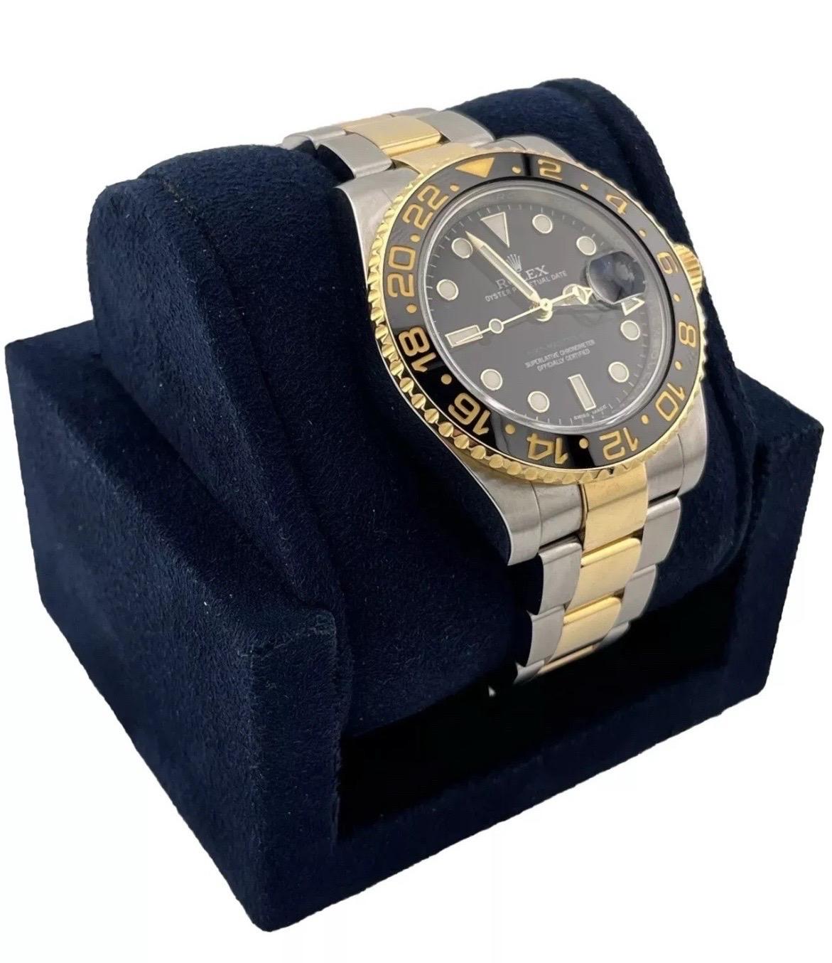 A true icon for world travelers and watch collectors alike, the Rolex GMT-Master II Ref. 116713LN combines bold design with practical functionality. Crafted from durable stainless steel and luxurious 18K yellow gold, this 40mm timepiece features a