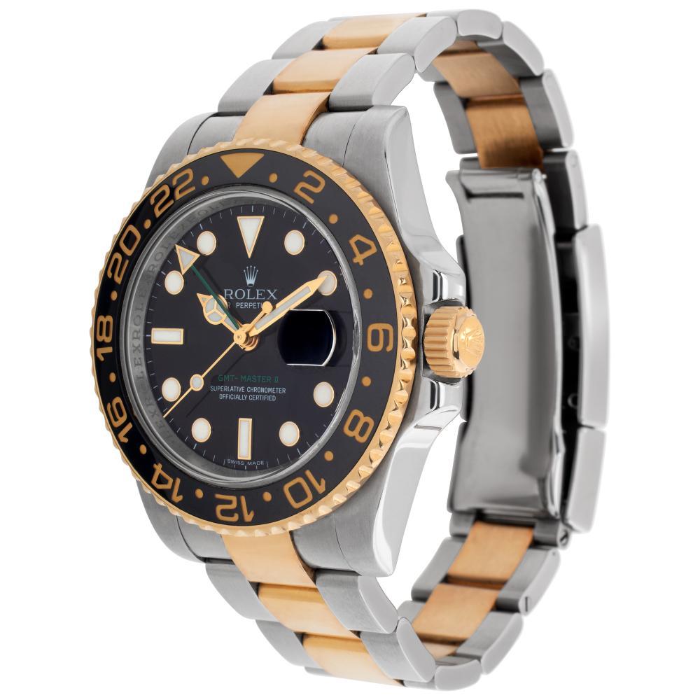 Rolex GMT-Master II in 18k yellow gold & stainless steel. Auto w/ sweep seconds, date and dual time. 40 mm case size. Complete, mint set, with box and papers. Ref 116713. Circa 2008. **Bank Wire Only At This Price** Fine Pre-owned Rolex Watch.