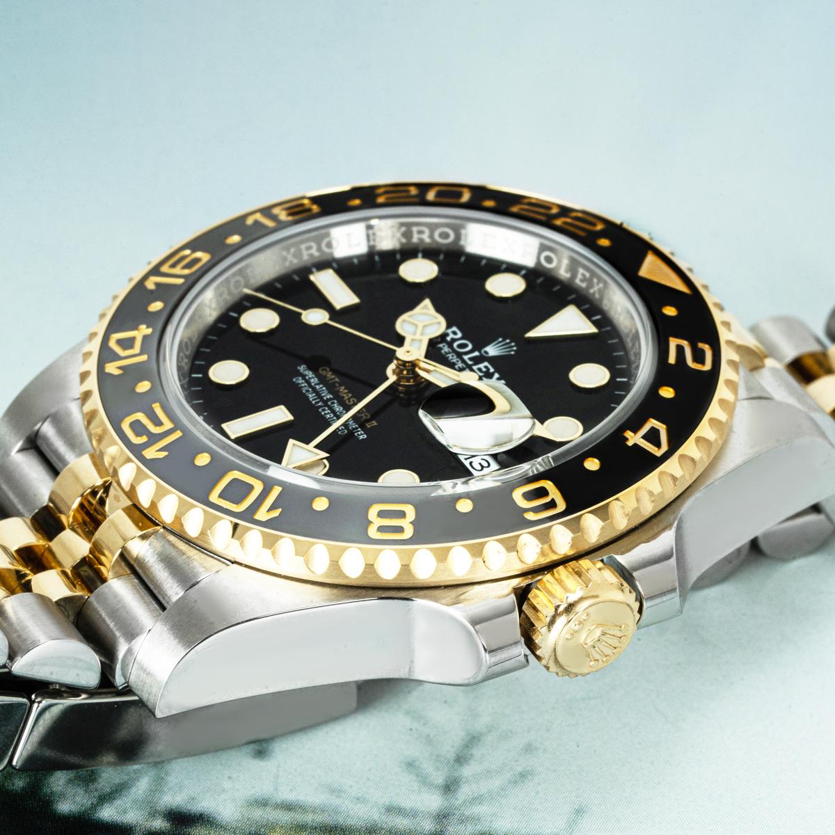 A 40mm Rolex GMT-Master in stainless steel and yellow gold. Featuring a black dial with applied hour markers and a date aperture. The watch also features a newly designed yellow gold 24-hour bi-directional rotating bezel with a black and grey
