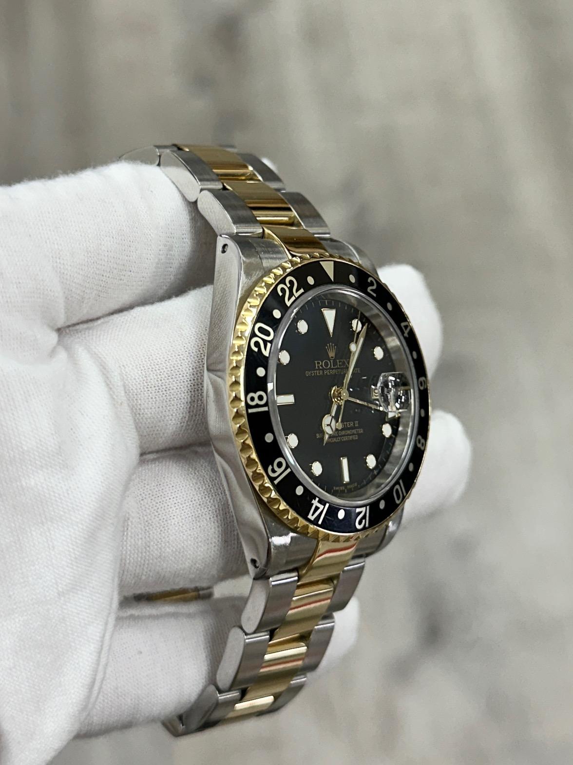 Rolex GMT Master II 16713 40mm Black Dial 18K Yellow Gold Steel Box Paper 2002 For Sale 1