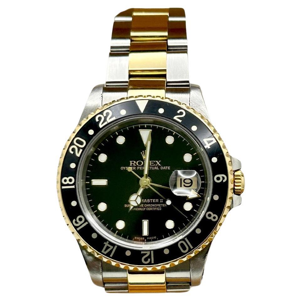 Rolex GMT Master II 16713 40mm Black Dial 18K Yellow Gold Steel Box Paper 2002 For Sale