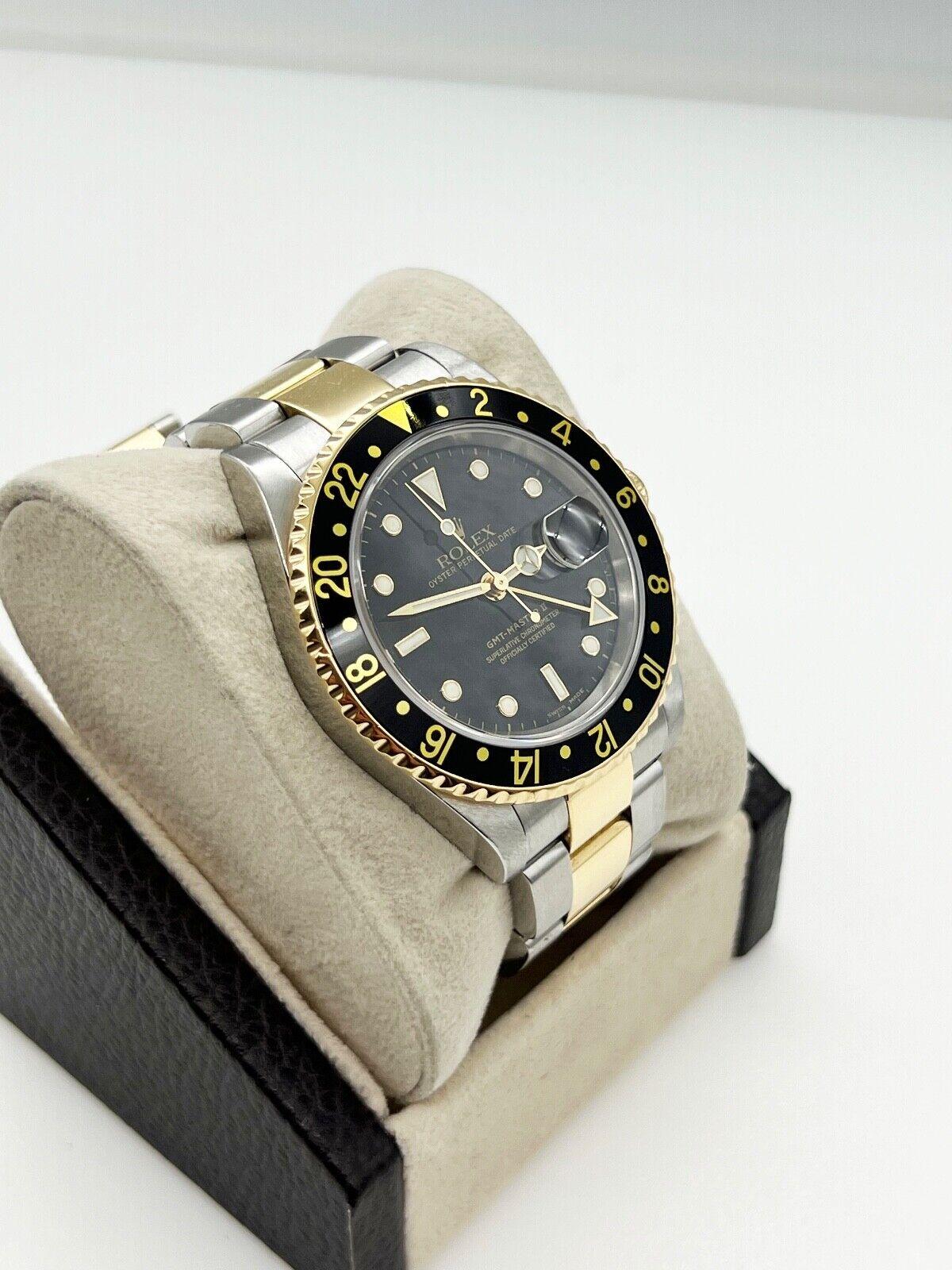 Rolex GMT Master II 16713 Black Dial 18K Yellow Gold Stainless Steel 2003 In Excellent Condition For Sale In San Diego, CA