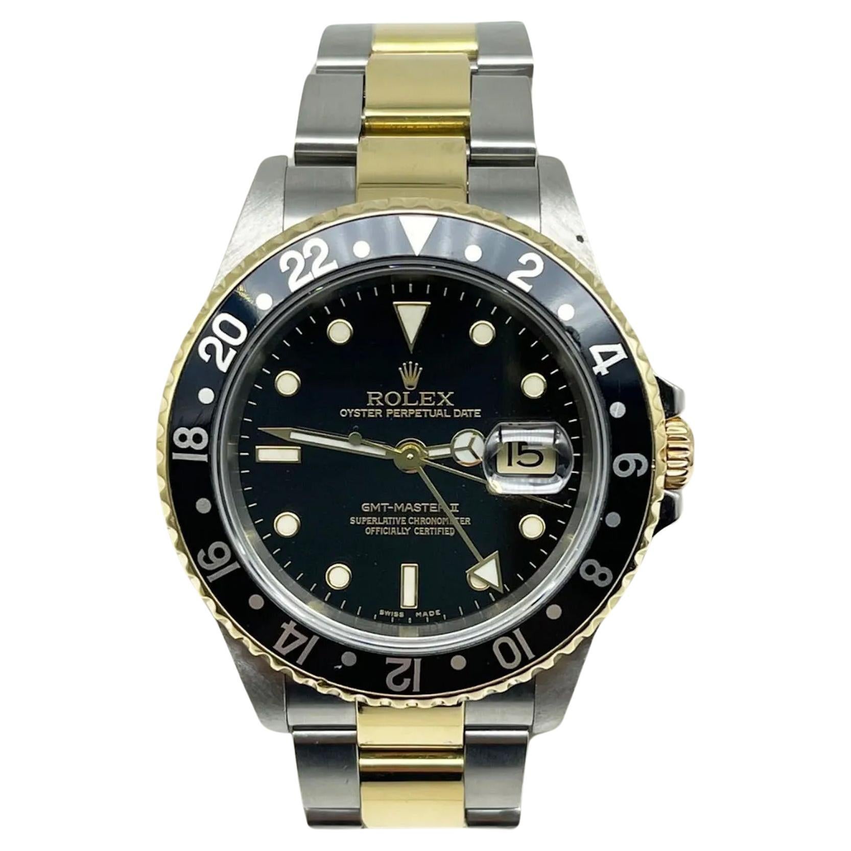 Rolex GMT Master II 16713 Black Dial 18K Yellow Gold Stainless Steel Box Paper