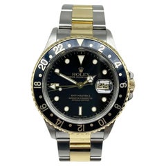 Rolex GMT Master II 16713 Esfera Negra Oro Amarillo 18K Caja de Acero Papel de Servicio