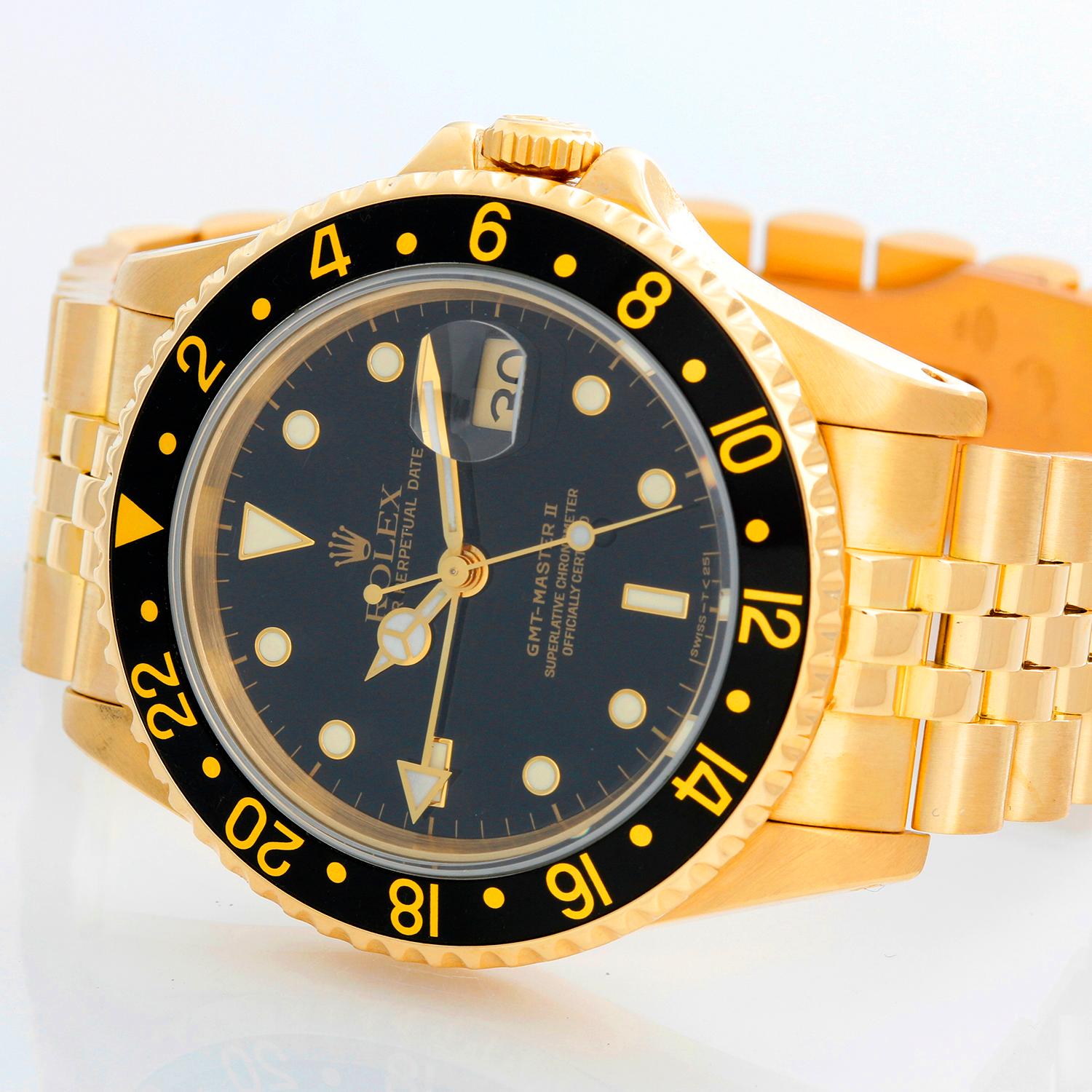 Rolex GMT - Master II 18K Yellow Gold Men's Watch 16718 - Automatic winding, 31 jewels, Quickset, sapphire crystal. 18k yellow gold case with rotating bezel (40mm diameter). Black dial with luminous markers. 18k yellow gold Jubilee bracelet.