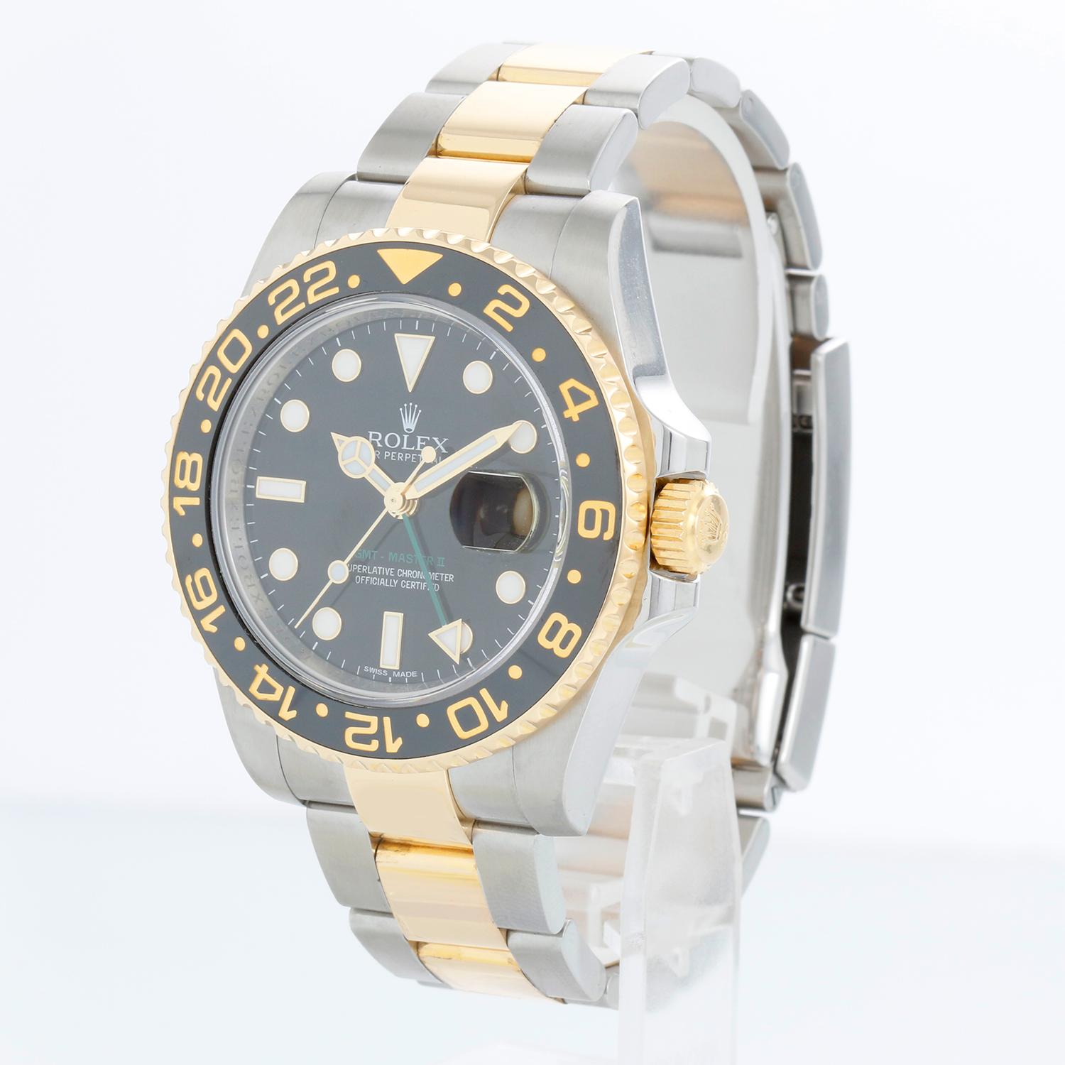 Rolex GMT-Master II 2-Tone Men's Watch 116713 with Green GMT hand - Automatic winding, 31 jewels, Quickset, sapphire crystal. Stainless steel case with 18k yellow gold bezel (40mm diameter). Black dial with luminous style markers. Stainless steel &
