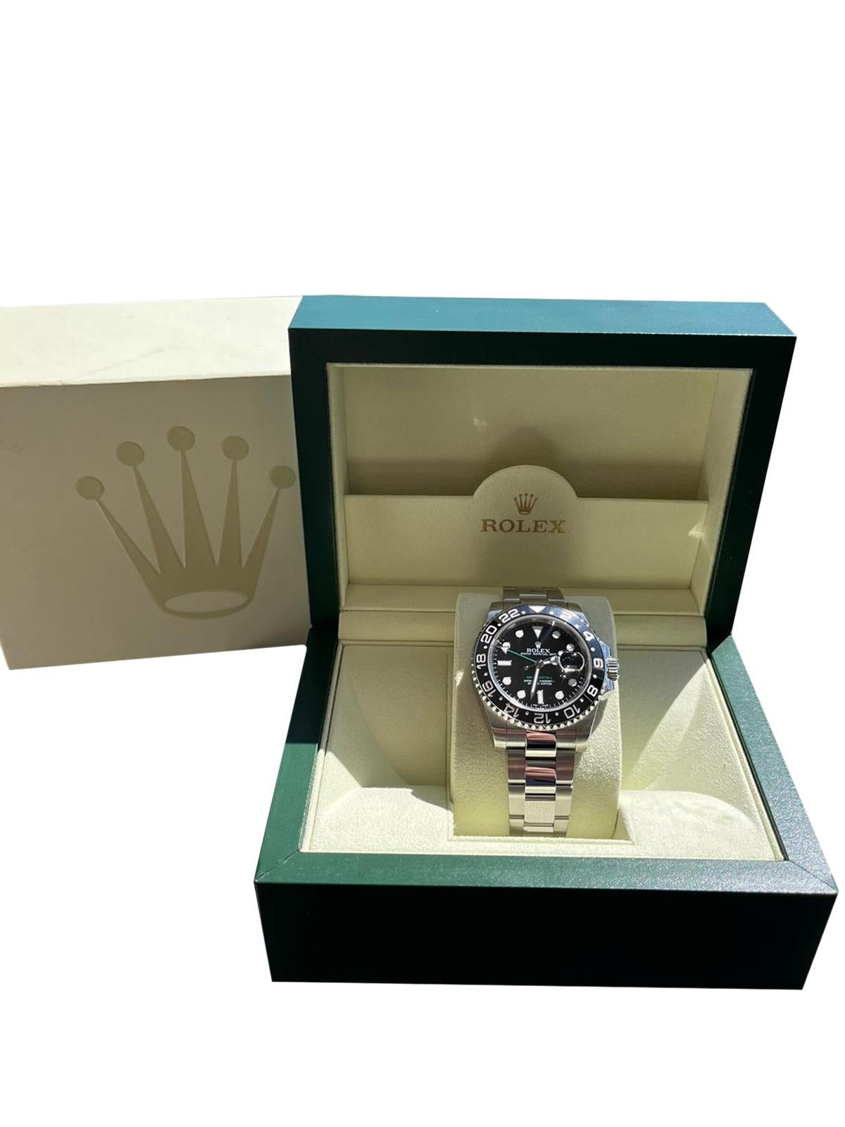 Rolex GMT-Master II 116710LN self-winding automatic watch features a 40mm stainless steel case surrounding a black dial on a stainless steel Oyster bracelet with a folding buckle. Functions include hours, minutes, seconds, dates, and GMT. This watch
