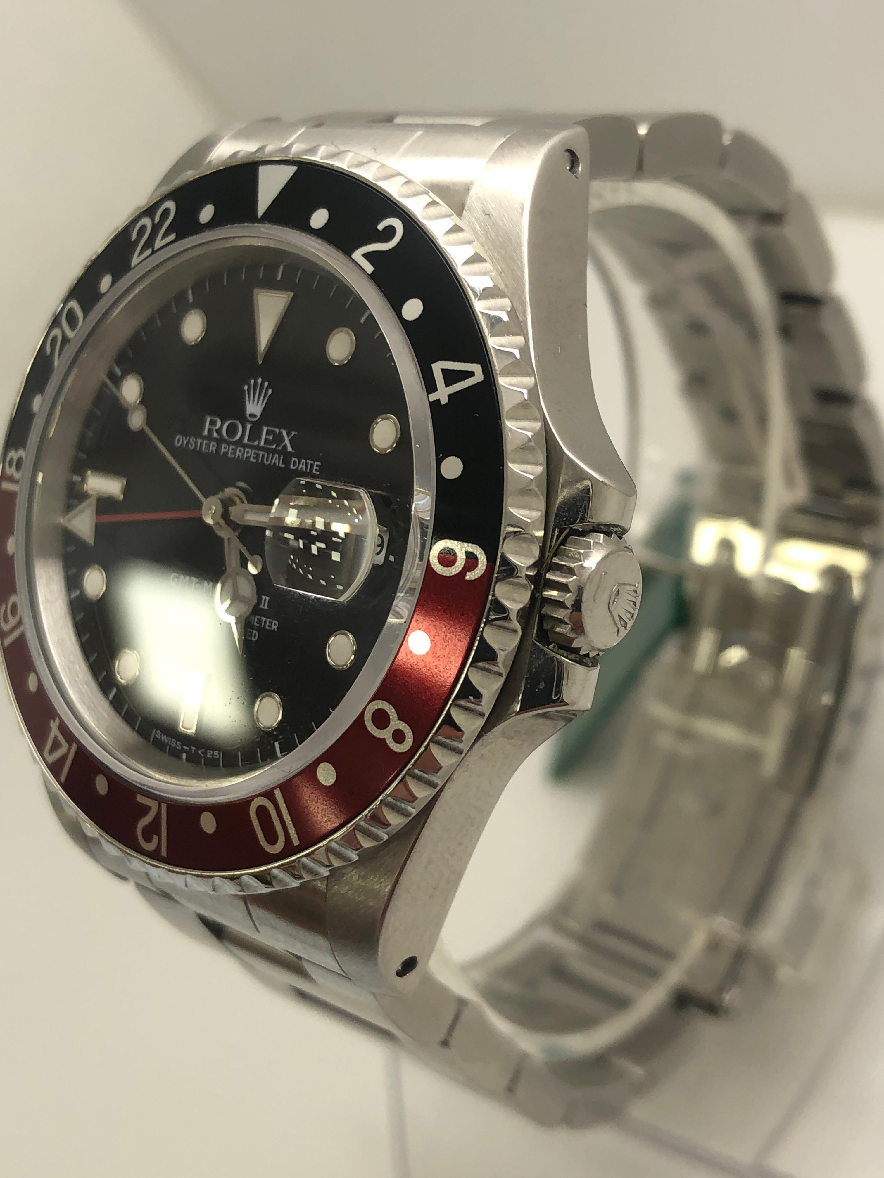 Rolex GMT-Master II Men's Black Watch with Red/Black Bezel - 16710

1990  box and papers included

very good condition

runs perfect

bank wire only  

shop with confidence