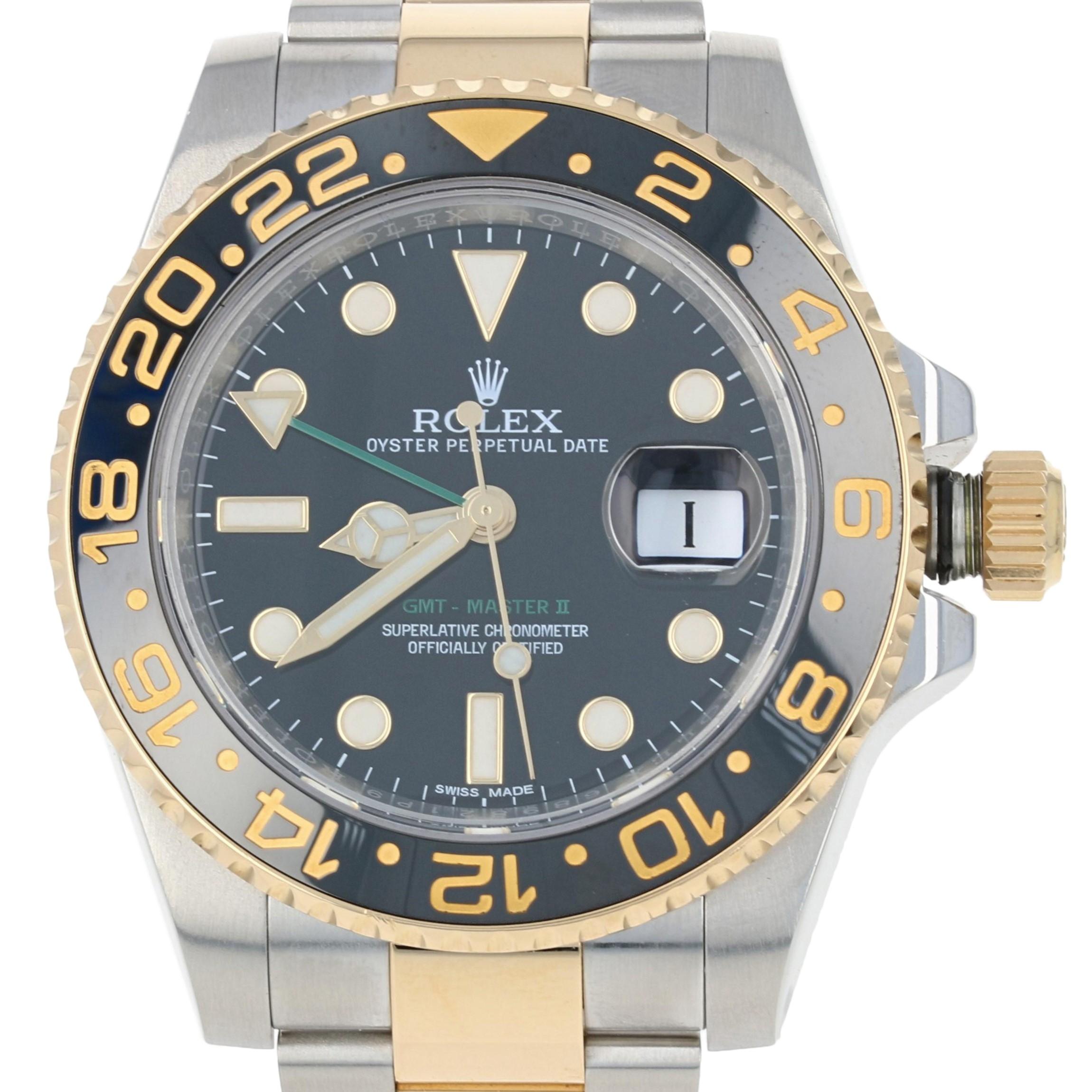 This is an authentic Rolex wristwatch. The watch has been professionally serviced and comes with a two-year warranty along with the Rolex boxes, papers, and an additional link.

Brand: Rolex GMT-Master II
Model Number: 116713
Materials: Stainless