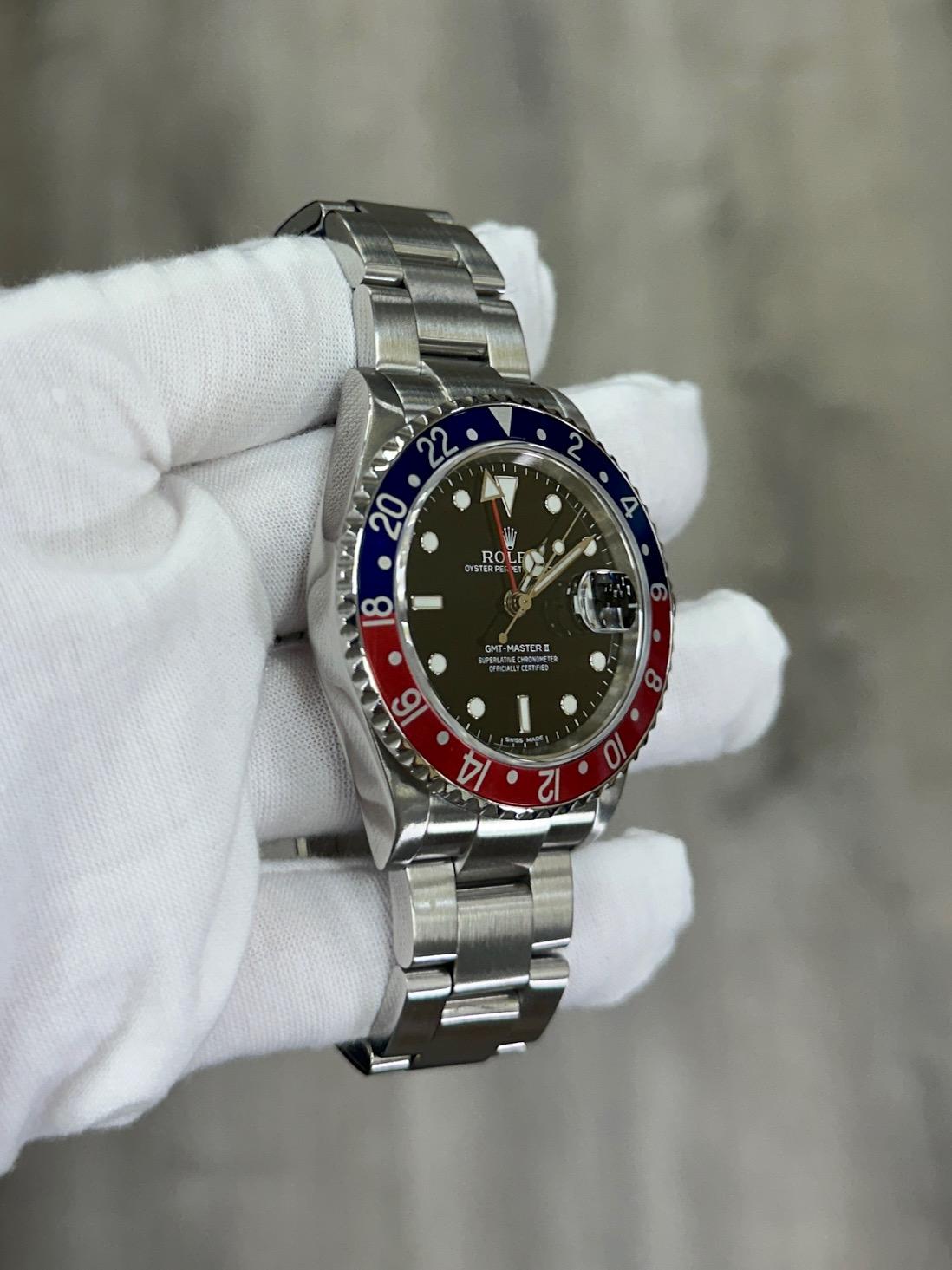 De los hombres Rolex GMT Master II Pepsi 16710 40mm Bisel rojo y azul Caja de acero Papeles 2006 en venta