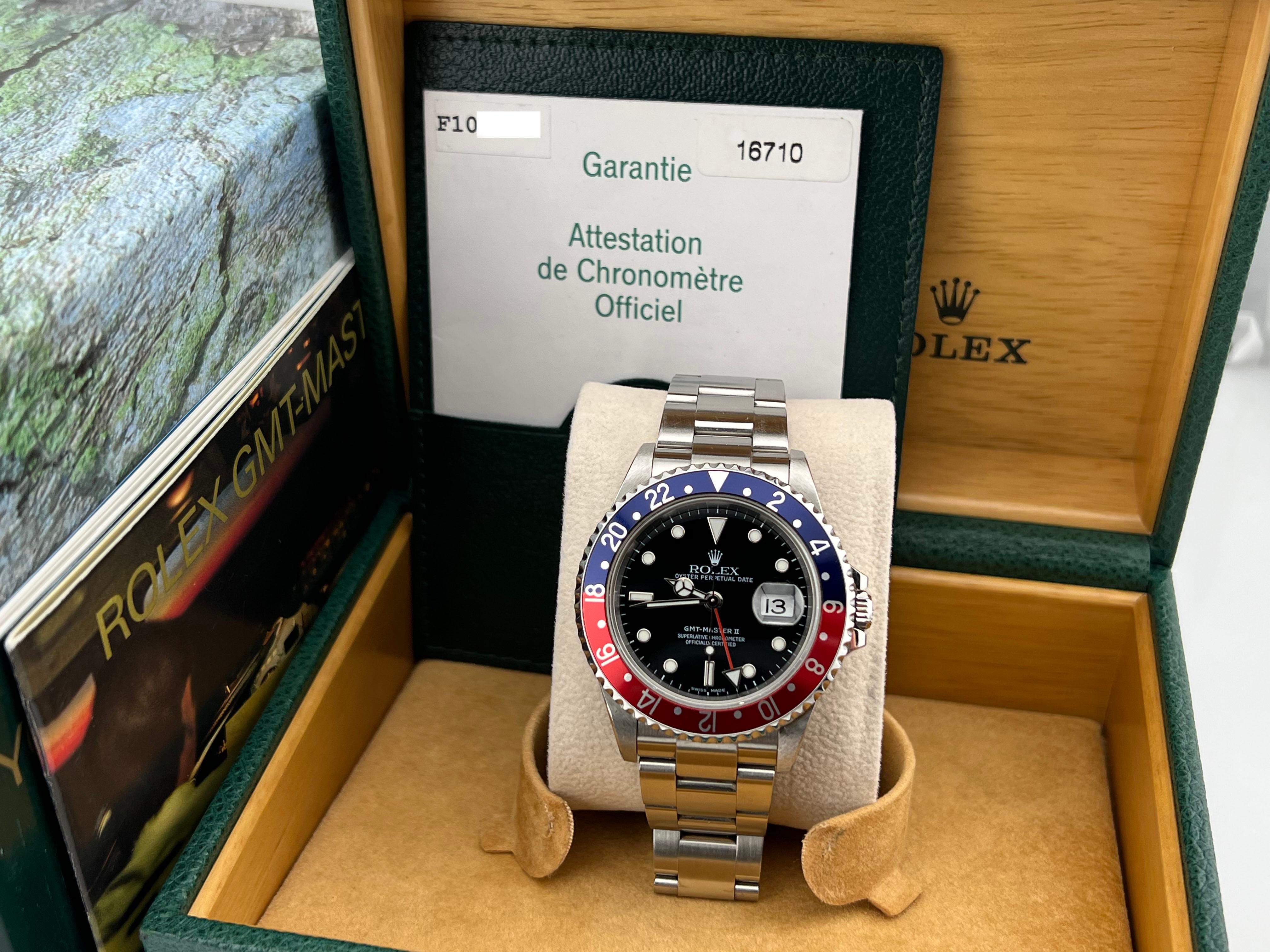 Style Number: 16710



Serial: F101***



Year: 2004

 

Model: Rolex GMT Master II

 

Case Material: Stainless Steel 

 

Band: Stainless Steel 

  

Bezel: Pepsi - Red and Blue 

  

Dial: Black 

 

Face: Sapphire Crystal 

 

Case Size: 40mm 

