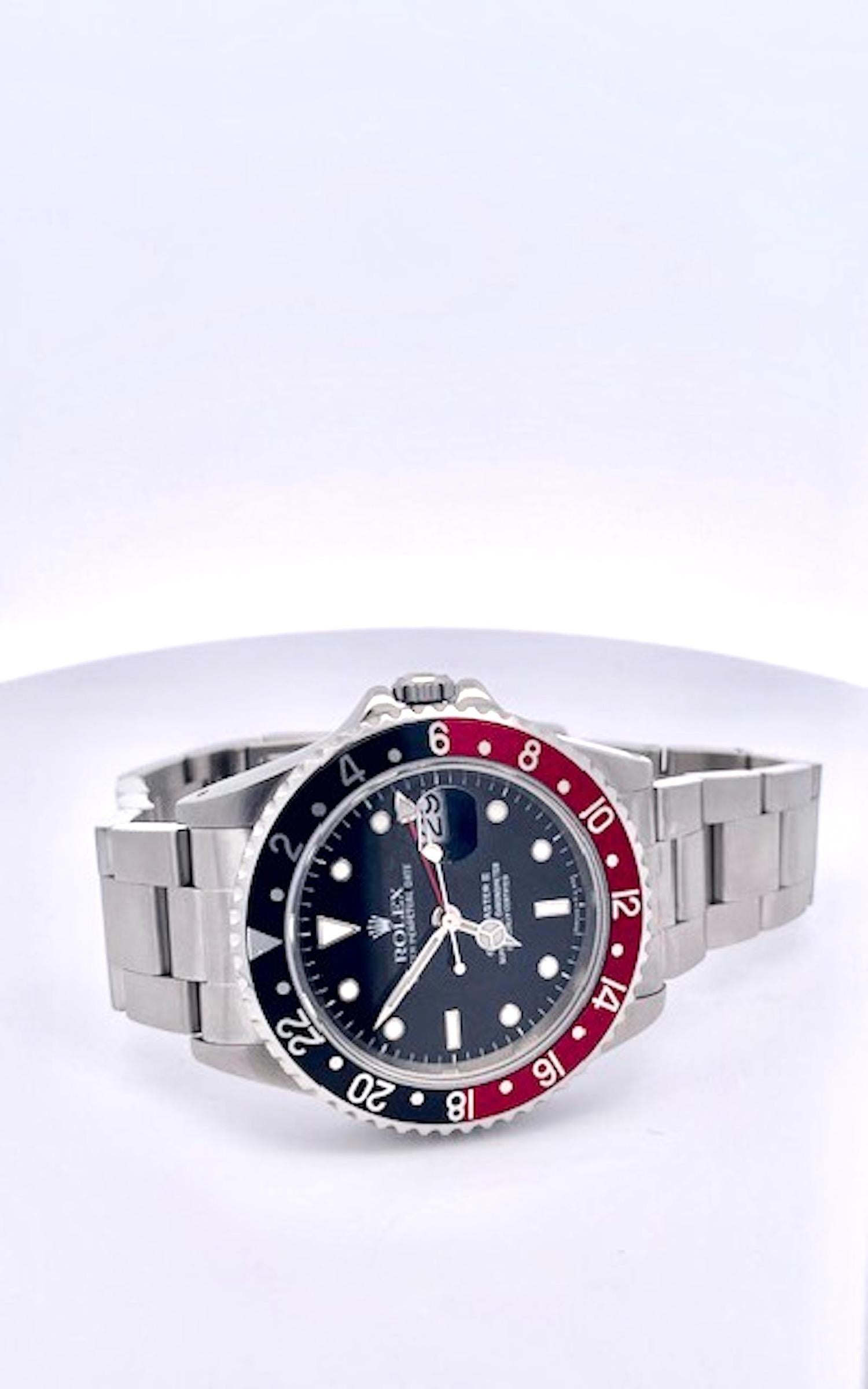 This watch was left to me by my brother who was a collector of Rolex watches.  This was his favorite watch.  A mens 40mm vintage GMT-Master in stainless steel by Rolex. Featuring a matte black dial, a date aperture, and a stainless steel