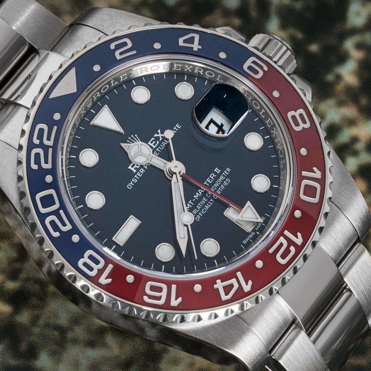 A GMT-Master II Pepsi by Rolex in white gold. Featuring a blue dial, date and red time zone hand. The blue and red bidirectional rotatable bezel features a 24-hour display. Equipped with an Oyster bracelet that comes together with an Oysterlock