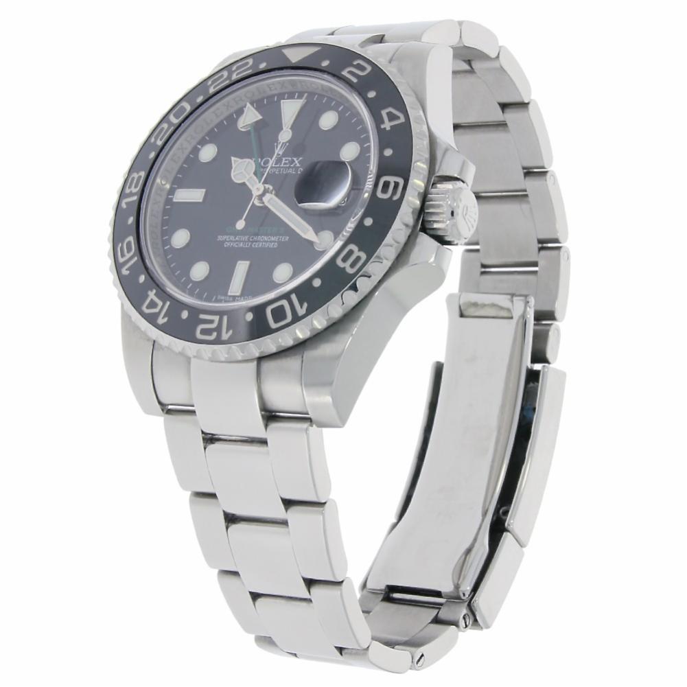 Rolex GMT Master II Reference #:116710. Stainless steel case with a stainless steel bracelet. Uni-directional rotating stainless steel bezel with black ceramic top ring Black dial with luminous hands and luminous dots hour markers. Minute markers