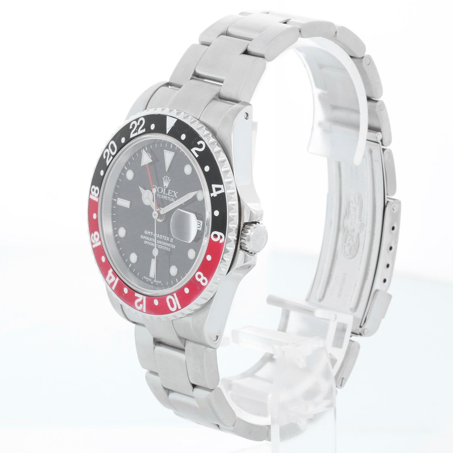 Rolex GMT-Master II Stainless Steel Men's Watch 16710 Black Dial & Bezel -  Automatic winding, 31 jewels, Quickset, sapphire crystal. Stainless steel case; rotating bezel with black and red bezel (40mm diameter). Black dial with luminous style