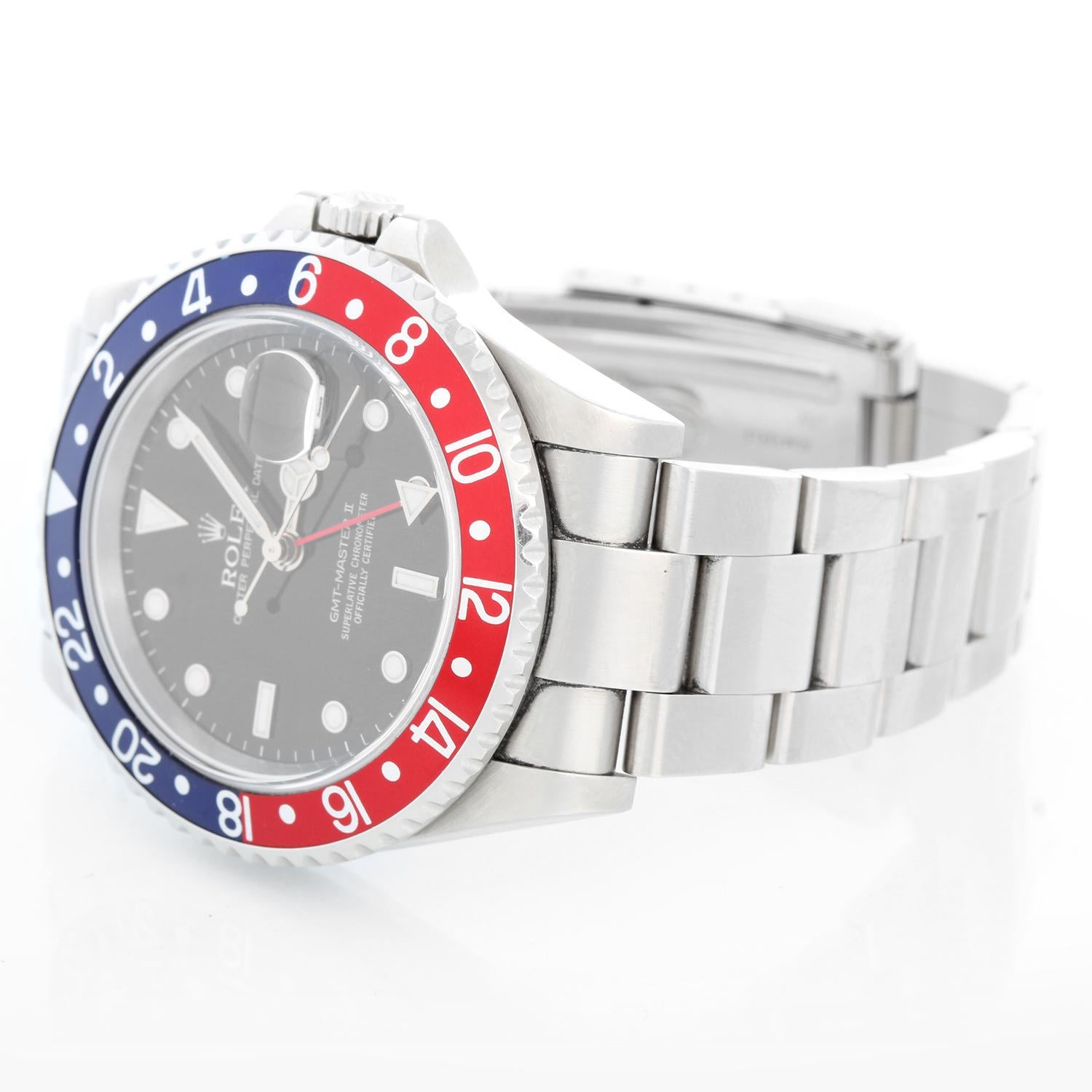 Rolex GMT-Master II Stainless Steel Men's Watch 16710 Blue/red Bezel - Automatic winding, 31 jewels, Quickset, sapphire crystal. Stainless steel case; rotating bezel with blue/red bezel (40mm diameter). Black dial with luminous style markers. Rolex