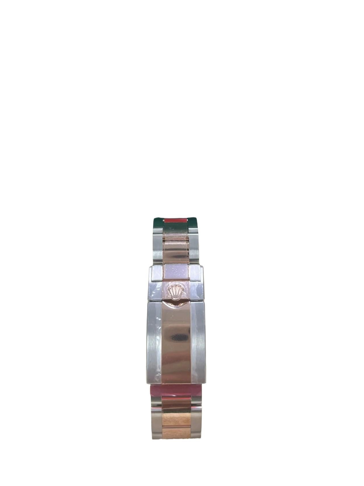 The 40mm Everose Rolesor case, a harmonious fusion of Everose gold and Oystersteel, forms the robust foundation of this distinguished timepiece. Its monobloc middle case is seamlessly integrated with a screw-down Everose gold crown, ensuring water