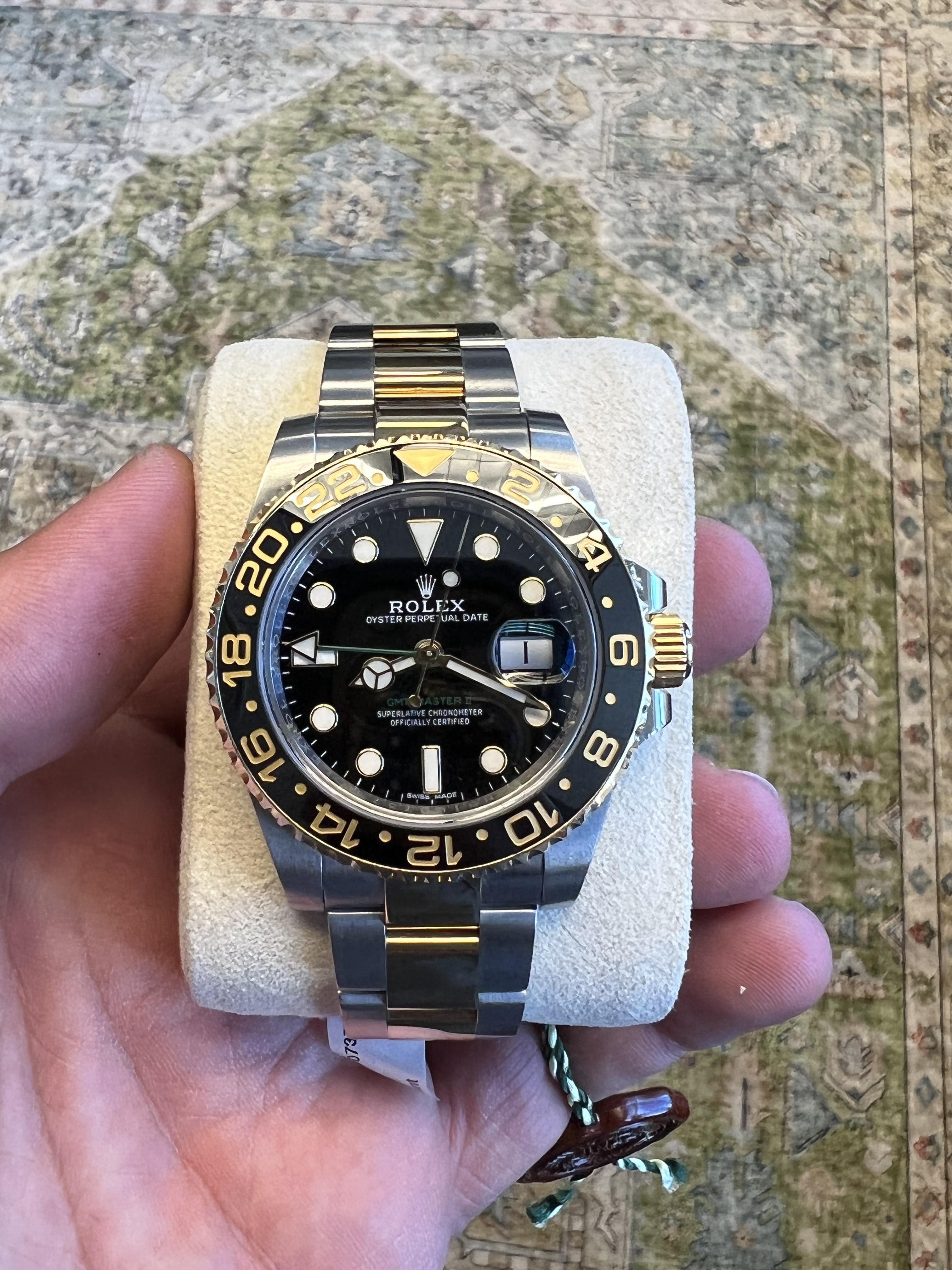 BRAND: Rolex
MODEL: GMT Master II
REFERENCE: 116713
SIZE: 40mm
CASE: 18k Yellow Gold and Stainless Steel
DIAL: Black
BEZEL: 18k Yellow Gold
BAND: 18k Yellow Gold and Stainless Steel
MOVEMENT: Automatic
WRIST SIZE: Apx. 7.75

Very Good condition with
