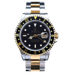 Rolex GMT-Master II bicolore in oro giallo e acciaio con quadrante nero 16713, anno 1991