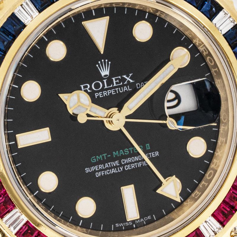 Rolex GMT-Master II Gelbgold Schwarzes Zifferblatt 116758SARU (Baguetteschliff)