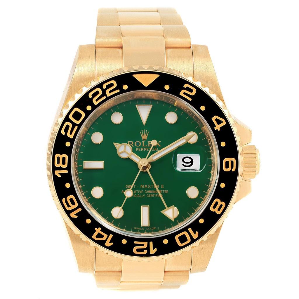Rolex GMT Master II Yellow Gold Green Dial Mens Watch 116718 Unworn. Officially certified chronometer automatic self-winding movement. 18K yellow gold case 40.0 mm in diameter. Rolex logo on a crown. 18k yellow gold bidirectional rotating bezel with