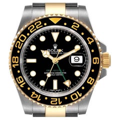 Rolex GMT Master II Herrenuhr aus Gelbgold mit schwarzem Zifferblatt 116713 Boxkarte