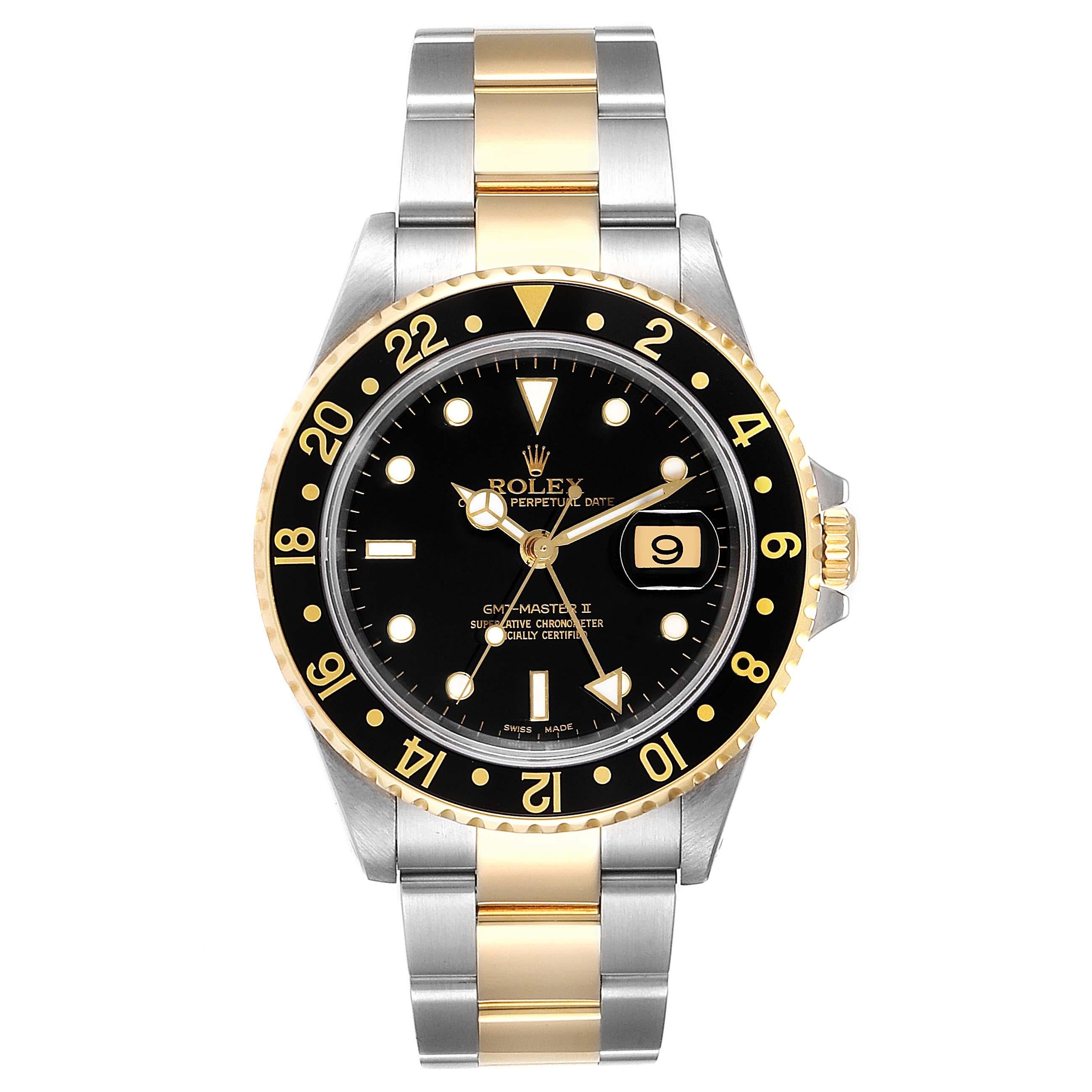 Rolex GMT Master II Yellow Gold Steel Oyster Bracelet Mens Watch 16713. Officially certified chronometer self-winding movement. Stainless steel case 40 mm in diameter. Rolex logo on a crown. 18k yellow gold bidirectional rotating bezel with a