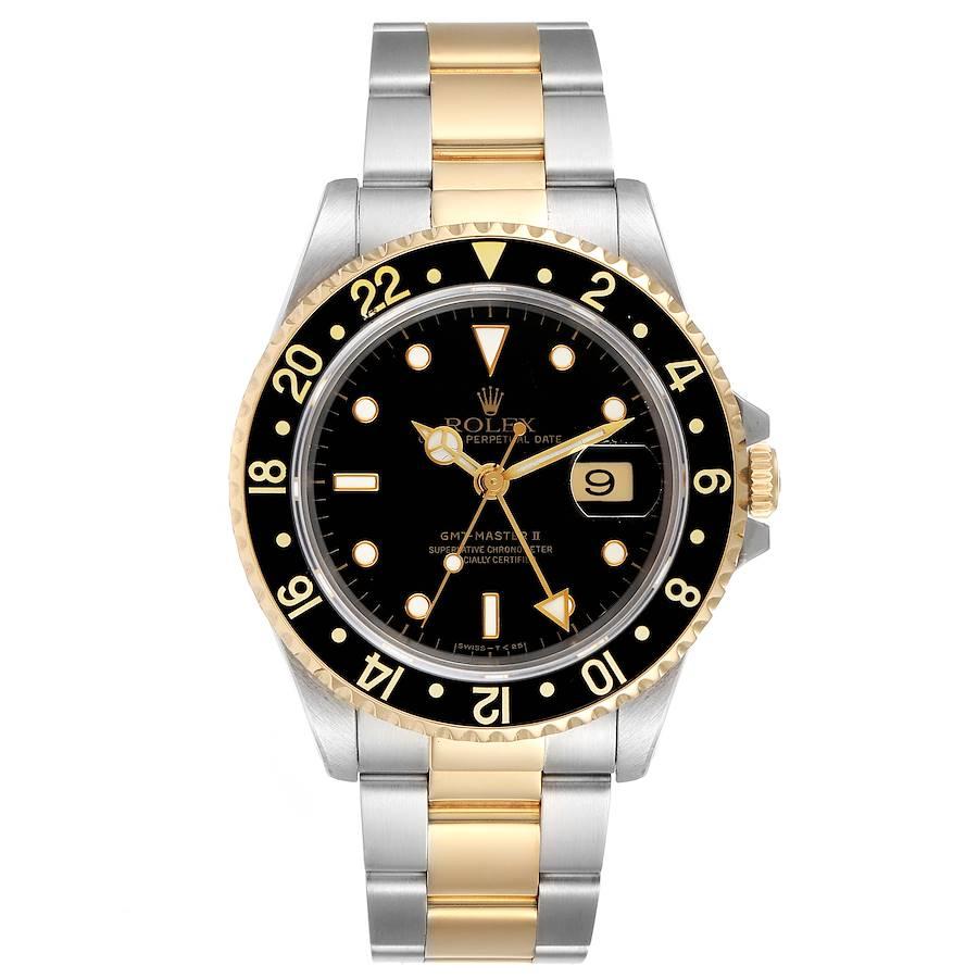 Rolex GMT Master II Yellow Gold Steel Oyster Bracelet Mens Watch 16713. Officially certified chronometer self-winding movement. Stainless steel case 40 mm in diameter. Rolex logo on a crown. 18k yellow gold bidirectional rotating bezel with a
