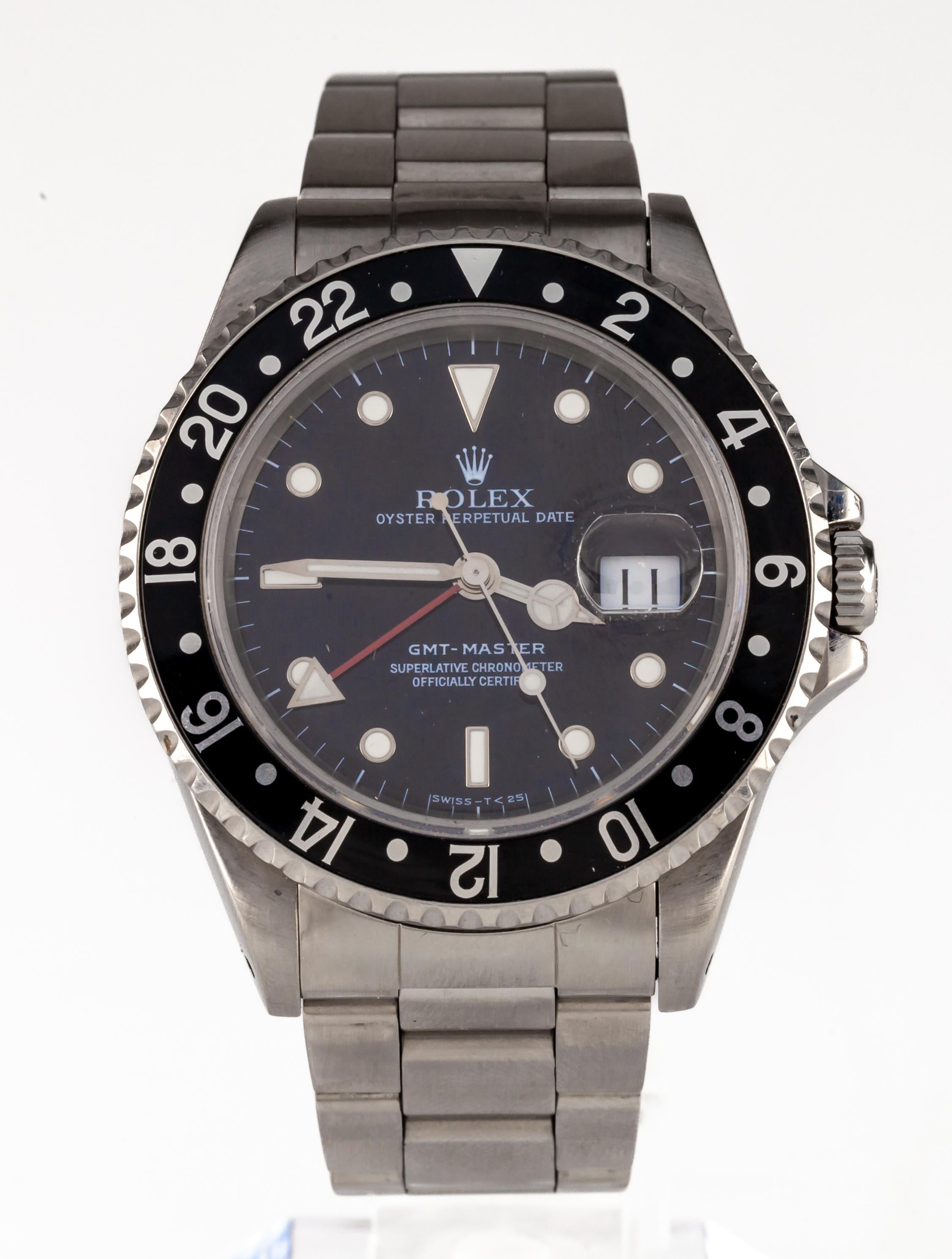 Rolex GMT Master Men's Stainless Steel Automatic Watch 16700 Black Dial 1996

Movement: 3175 (31 Jewels)
Movement Serial #78389XX
Model: 16700
Serial #T9925XX
Year: 1996

Stainless Steel Case w/ Black Bi-Directional Bezel
40 mm in Diameter (42 mm w/