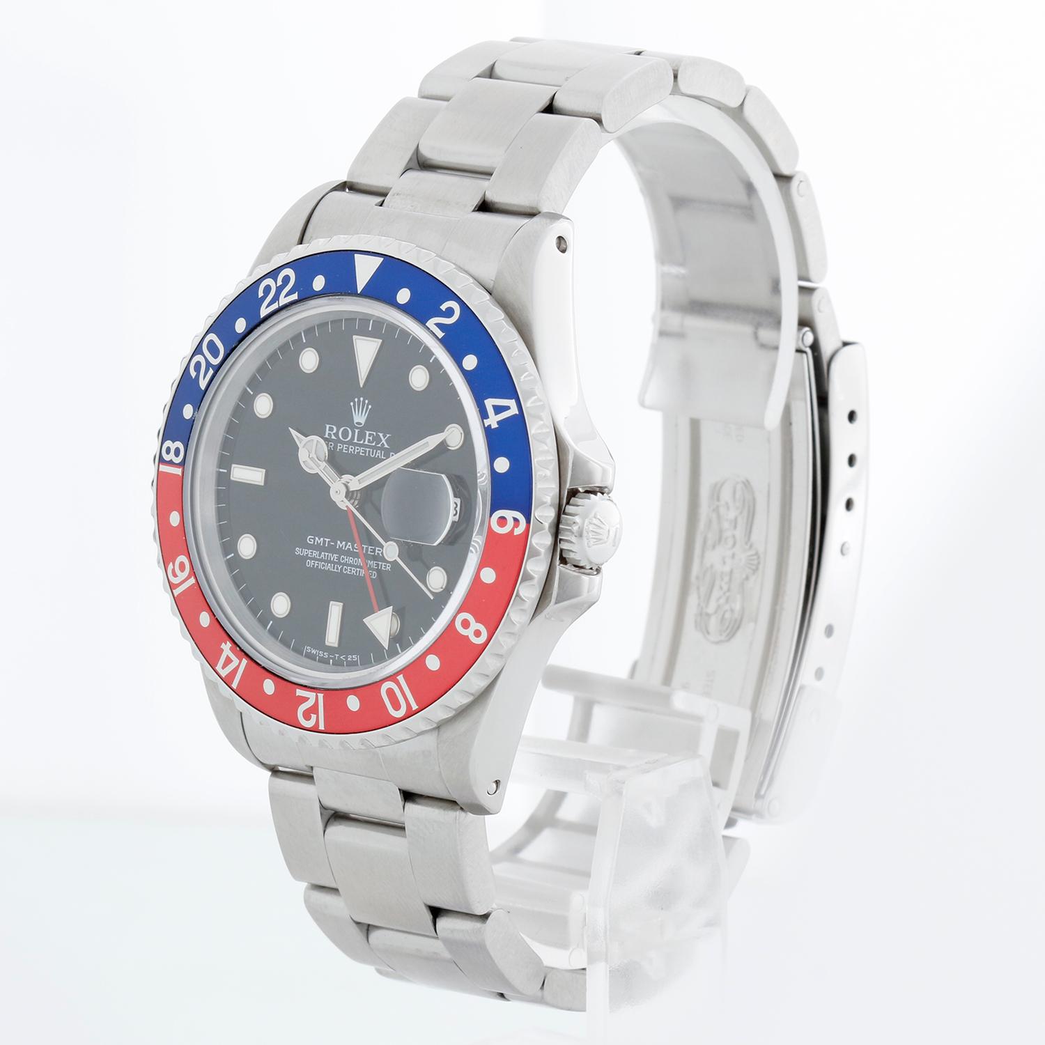 Reloj Rolex GMT-Master de acero inoxidable para hombre 16700 - De cuerda automática, 31 rubíes, Quickset, cristal de zafiro. GMT-Master. Caja de acero inoxidable con bisel giratorio rojo y azul (40 mm). Esfera negra con marcadores luminosos.