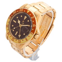 Montre-bracelet Rolex GMT Masterly référence 1675 / 8 en or jaune 18 carats, 'Root Beer' 1972
