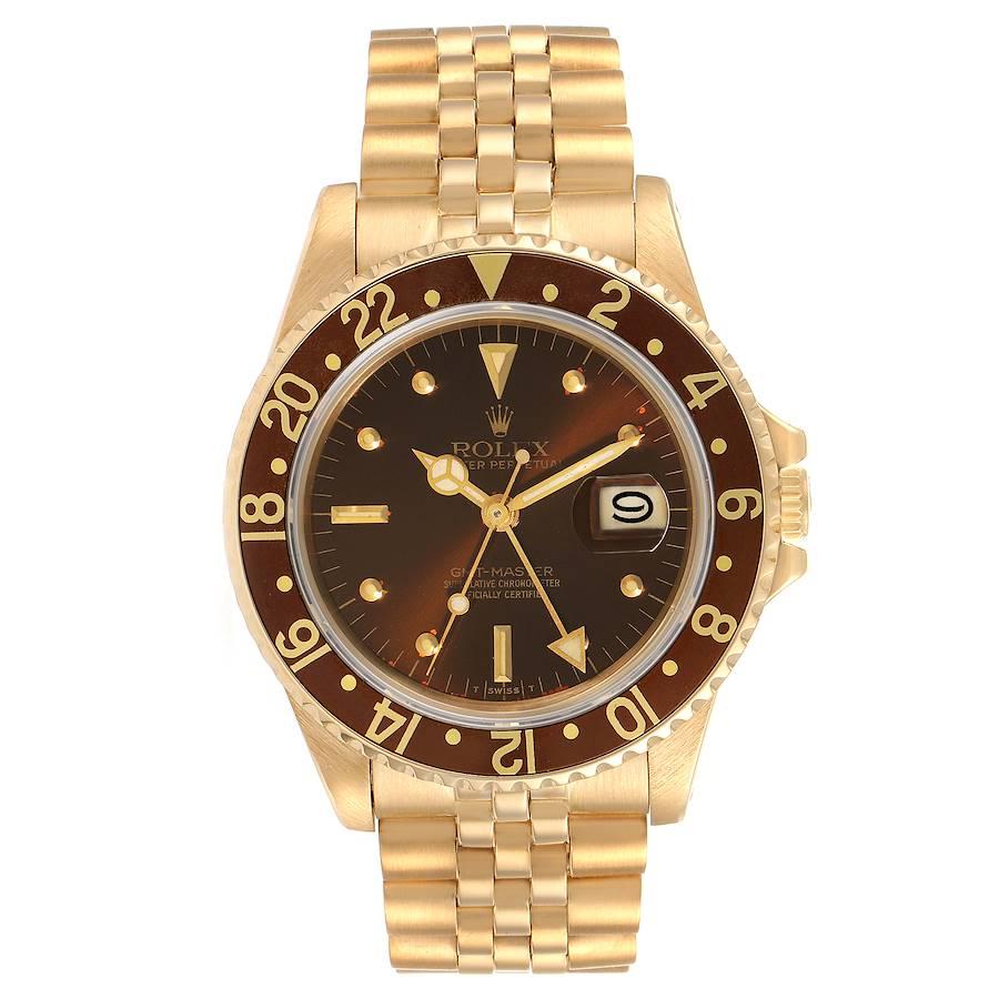 Rolex GMT Master Rootbeer 18k Yellow Gold Mens Vintage Watch 16758. Officially certified chronometer self-winding movement. 18K yellow gold case 40.0 mm in diameter. Rolex logo on a crown. 18k yellow gold bidirectional rotating bezel with a special